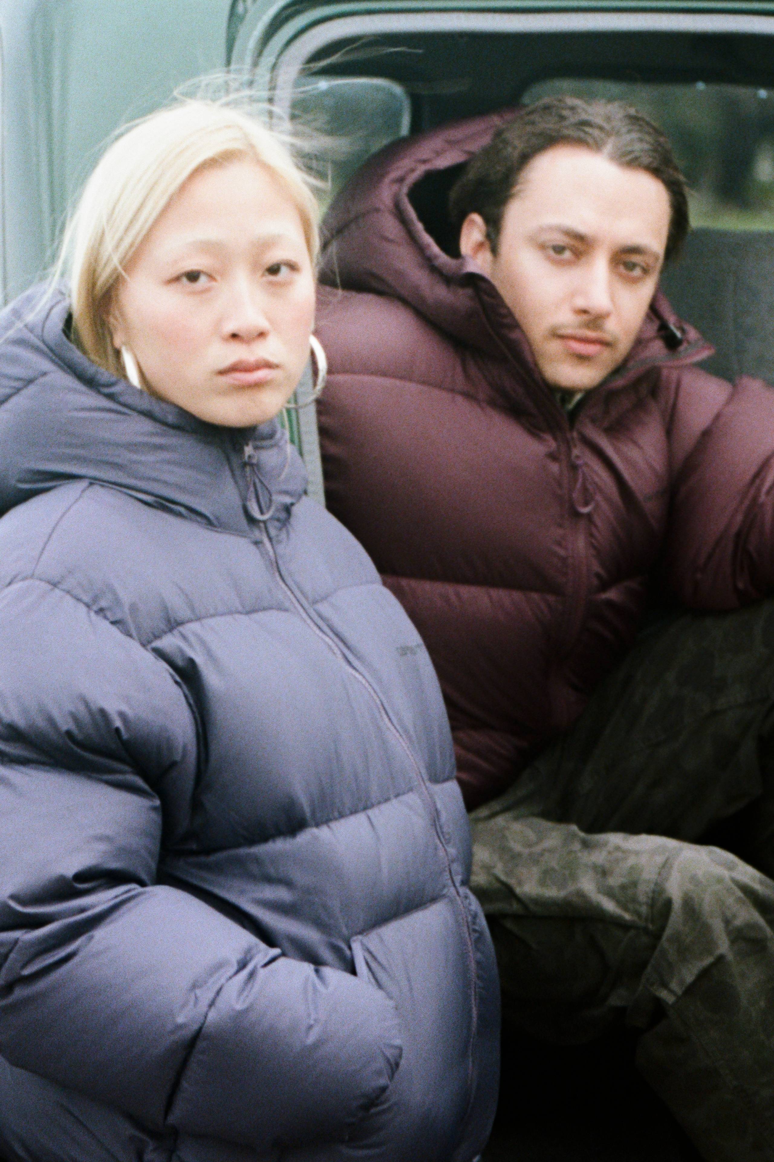 Models wearing a Toronto Jacket sitting in a car