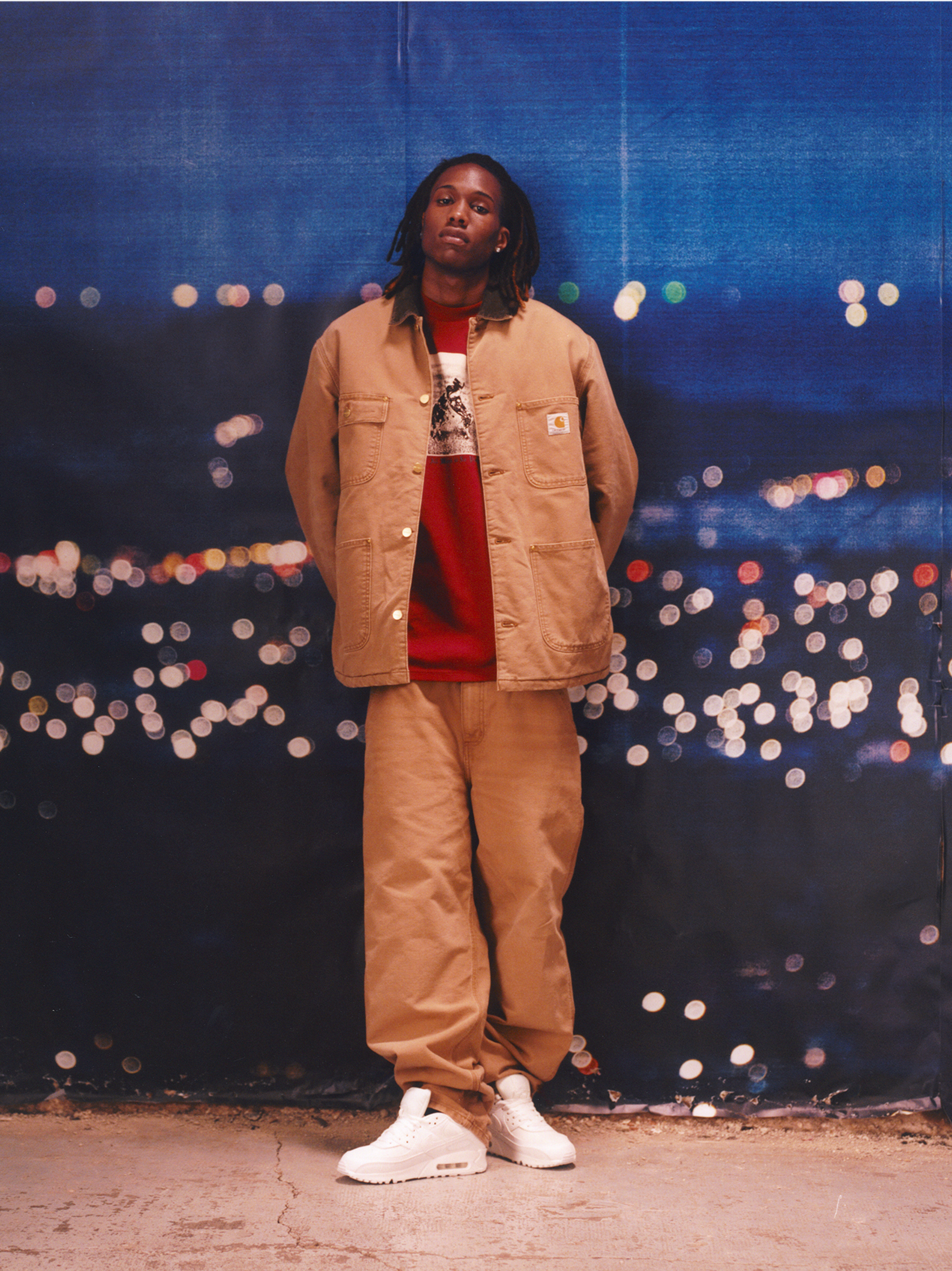 Model wearing a tan Chore Coat and tan Single Knee Pants in the Carhartt WIP F/W25 Men's Lookbook