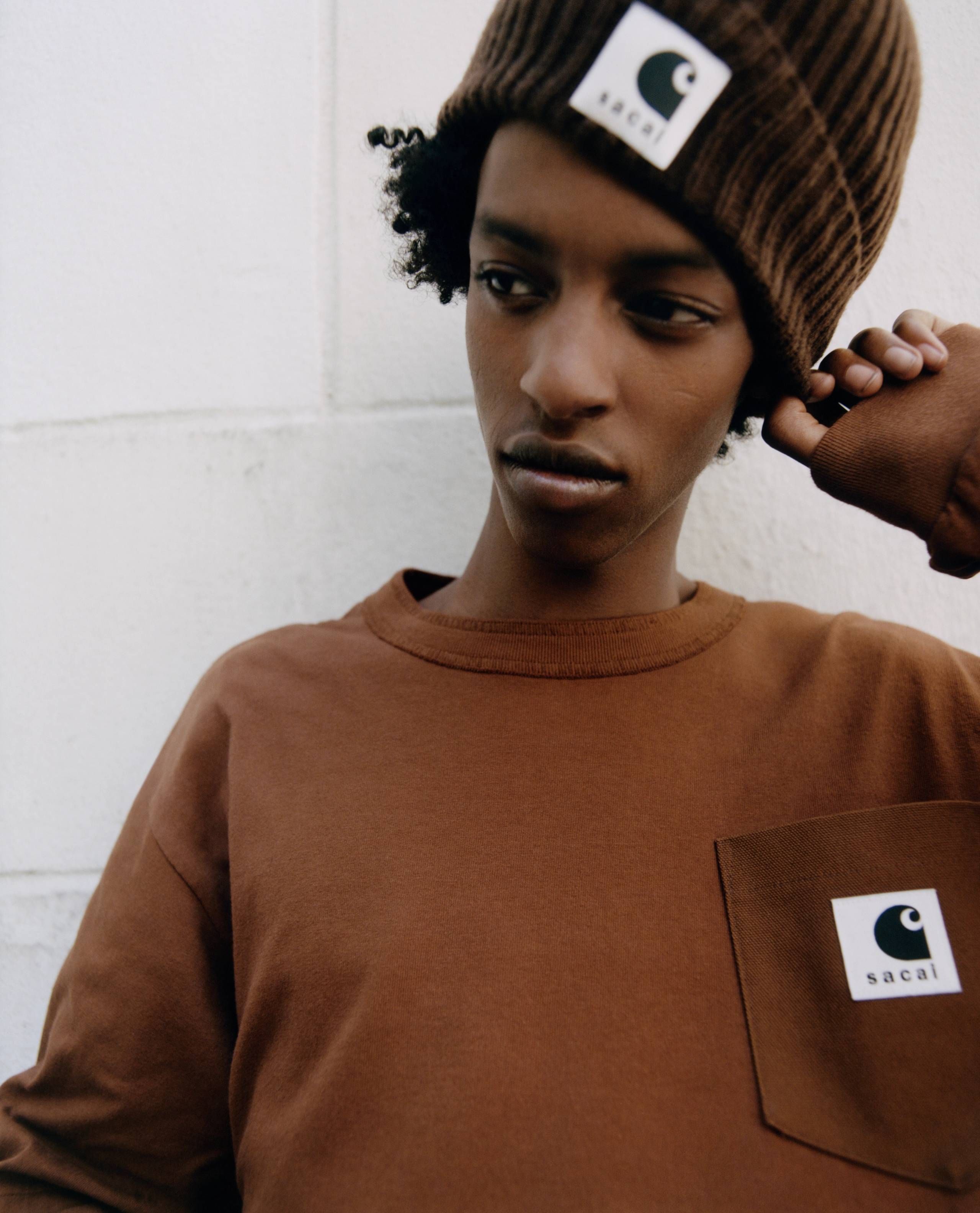 person wearing a sacai x carhartt WIP beanie and longsleeve shirt