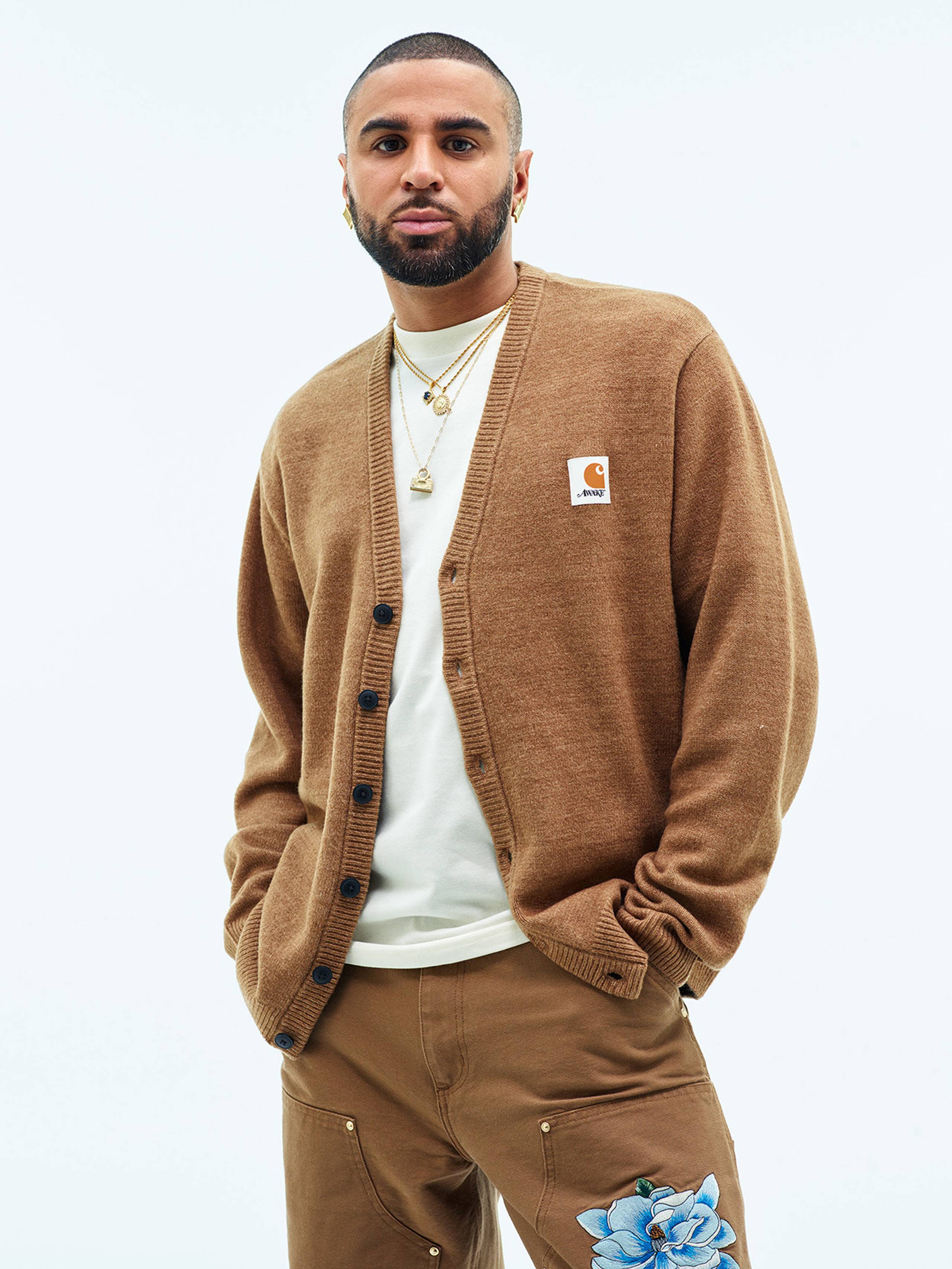 Model wearing Carhartt WIP x Awake NY cardigan in Hamilton Brown