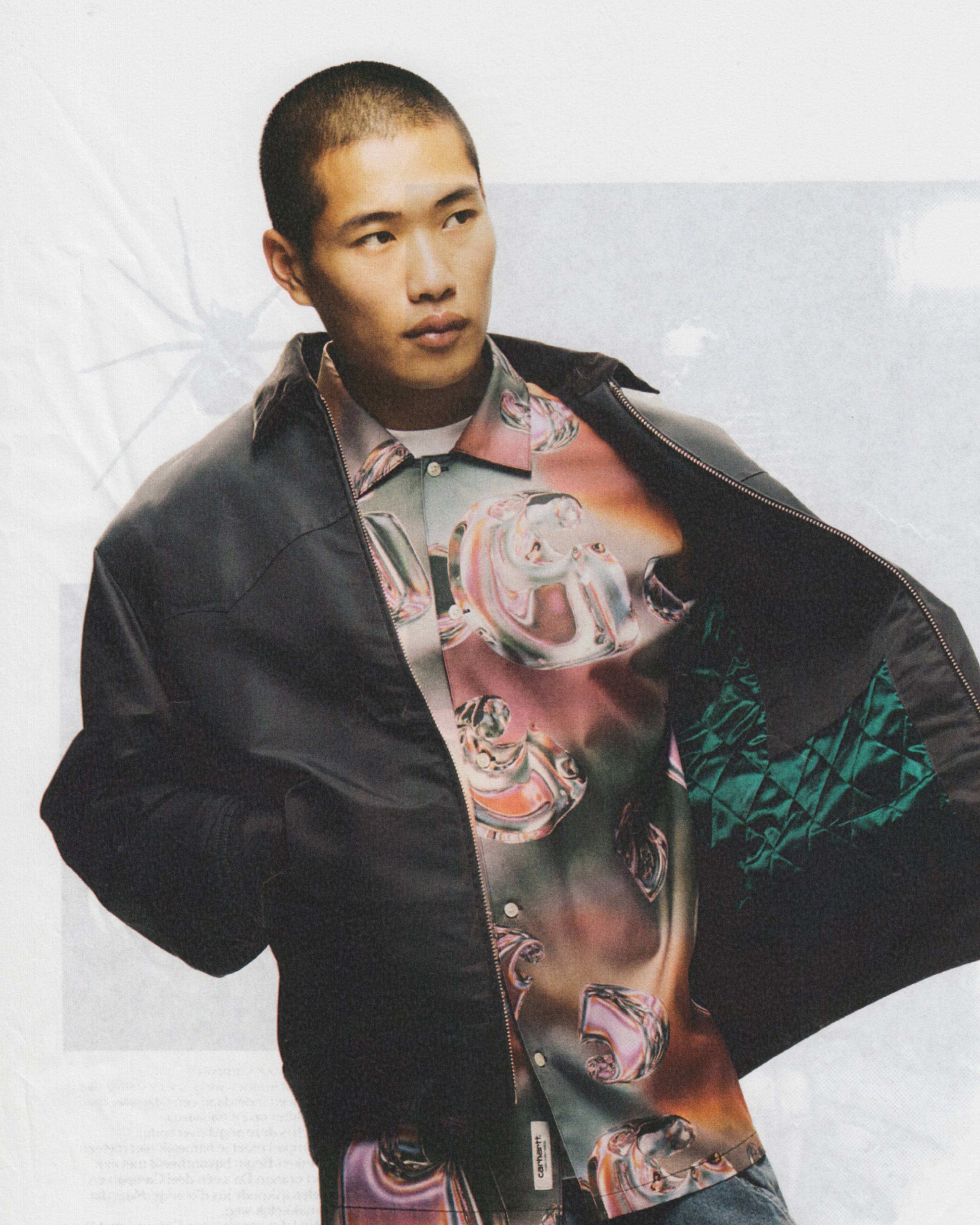 Model wearing Short Sleeve Solar Chrome Shirt and a Santa Fe Alumni Jacket in Dark Fir
