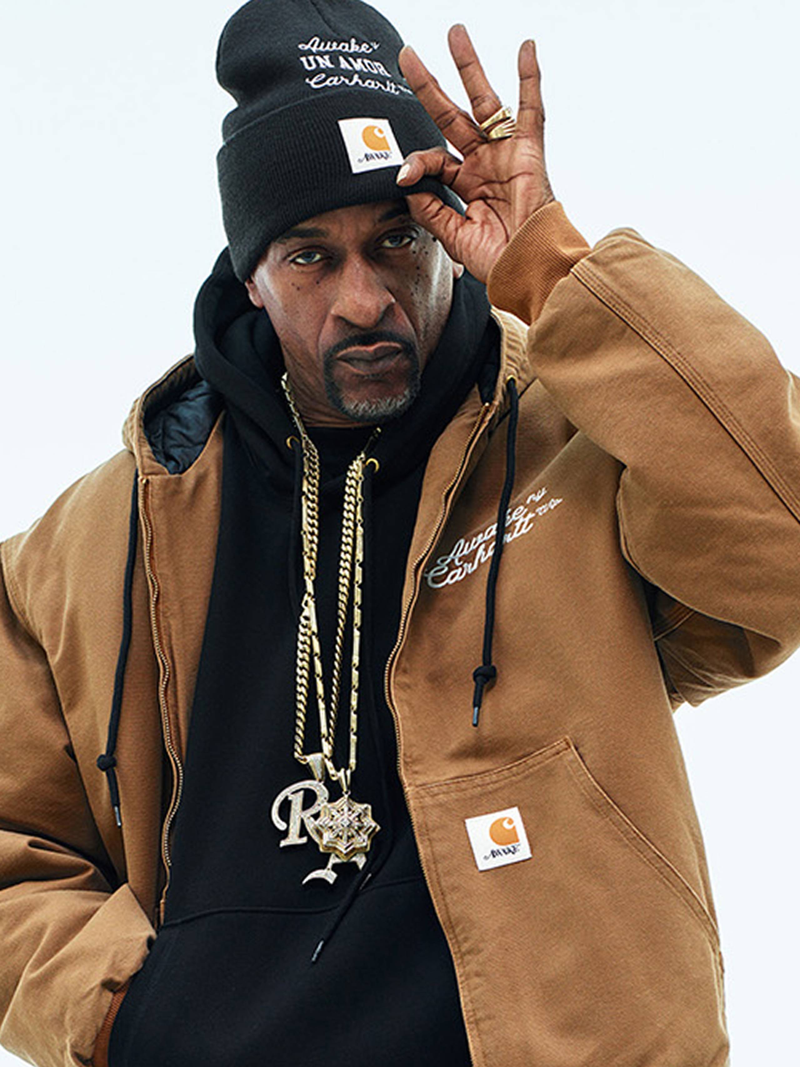 Model wearing Carhartt WIP x Awake NY OG Active Jacket in Hamilton Brown