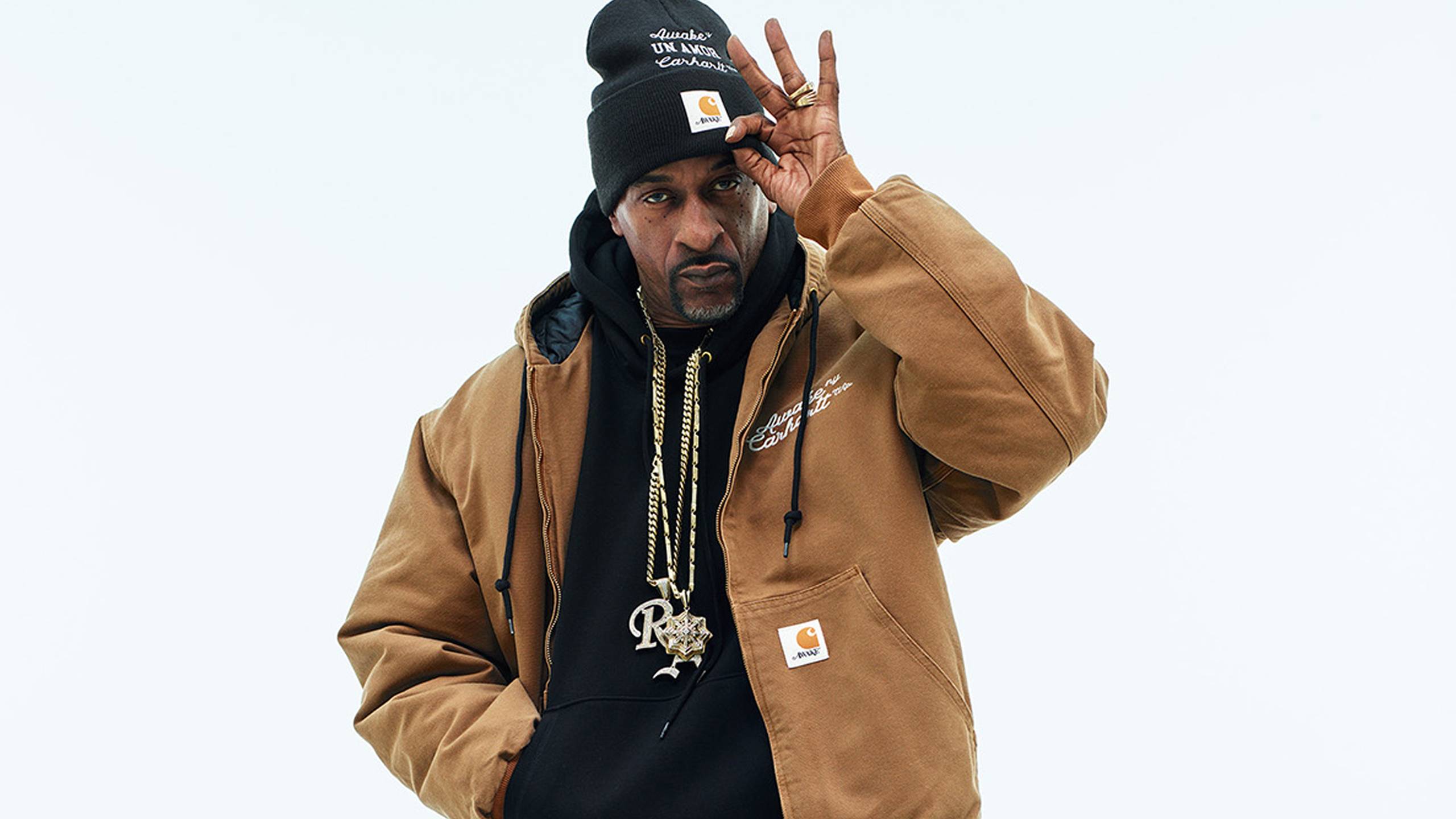 Model wearing Carhartt WIP x Awake NY OG Active Jacket in Hamilton Brown