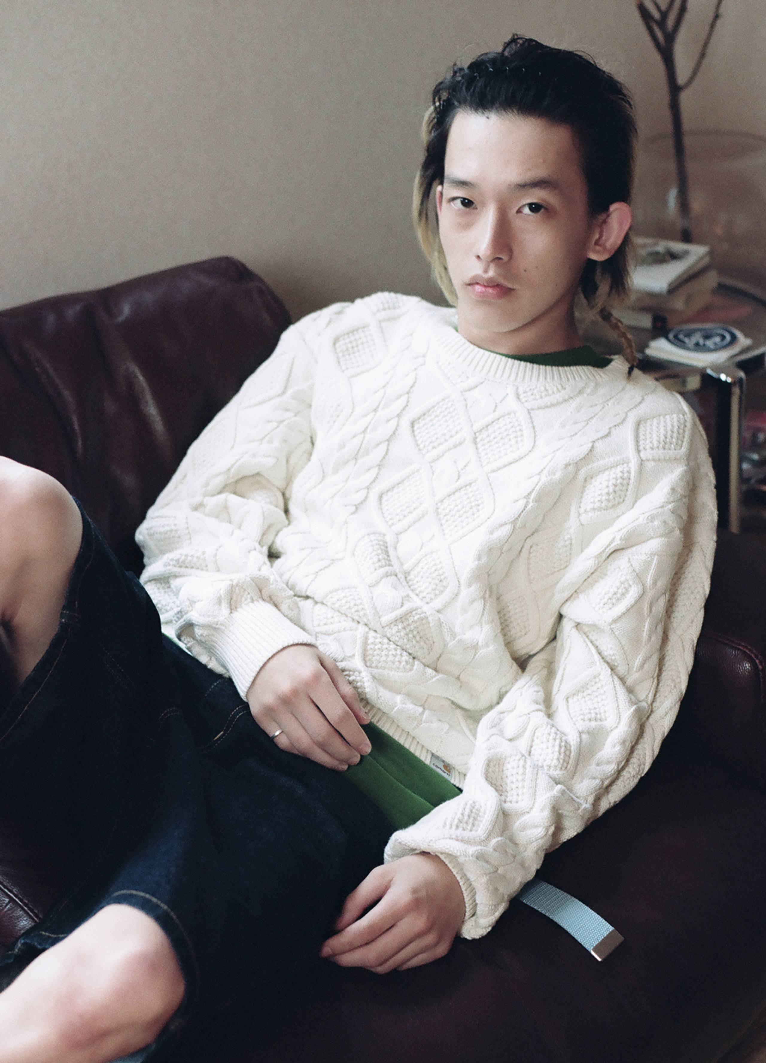 Model wearing white Carhartt WIP knit sweater