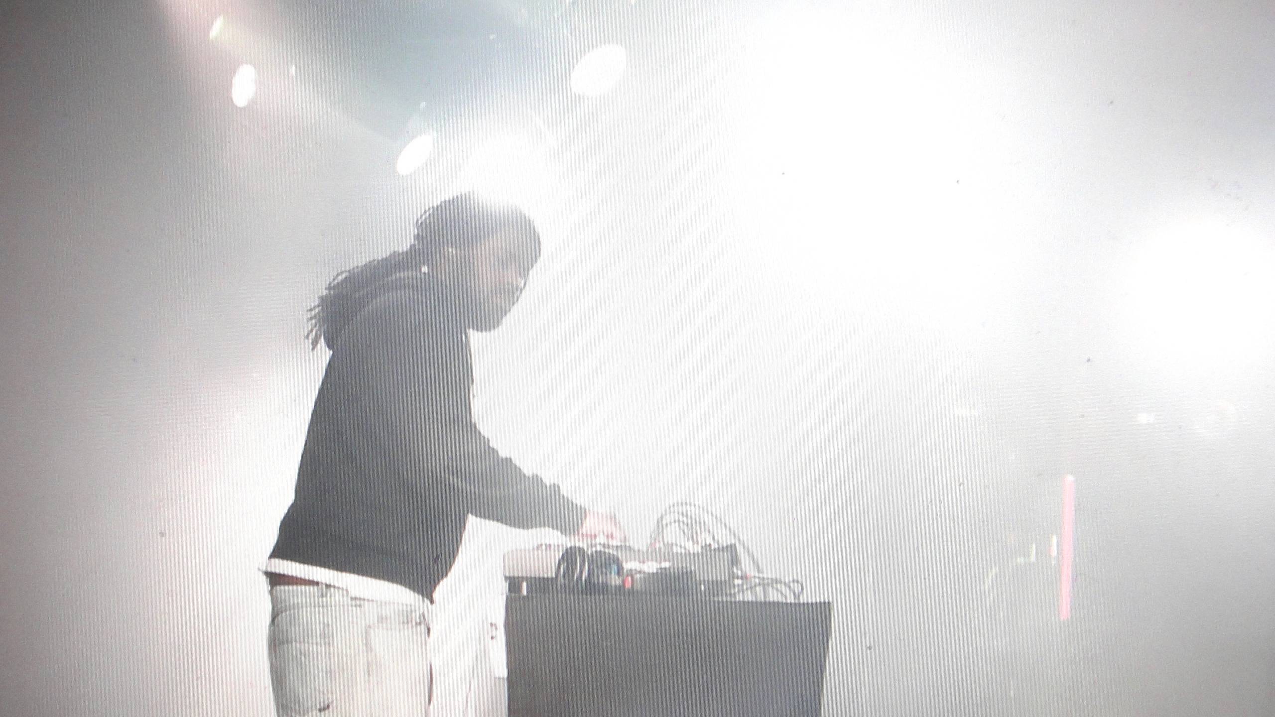 Person at a DJ booth on a stage