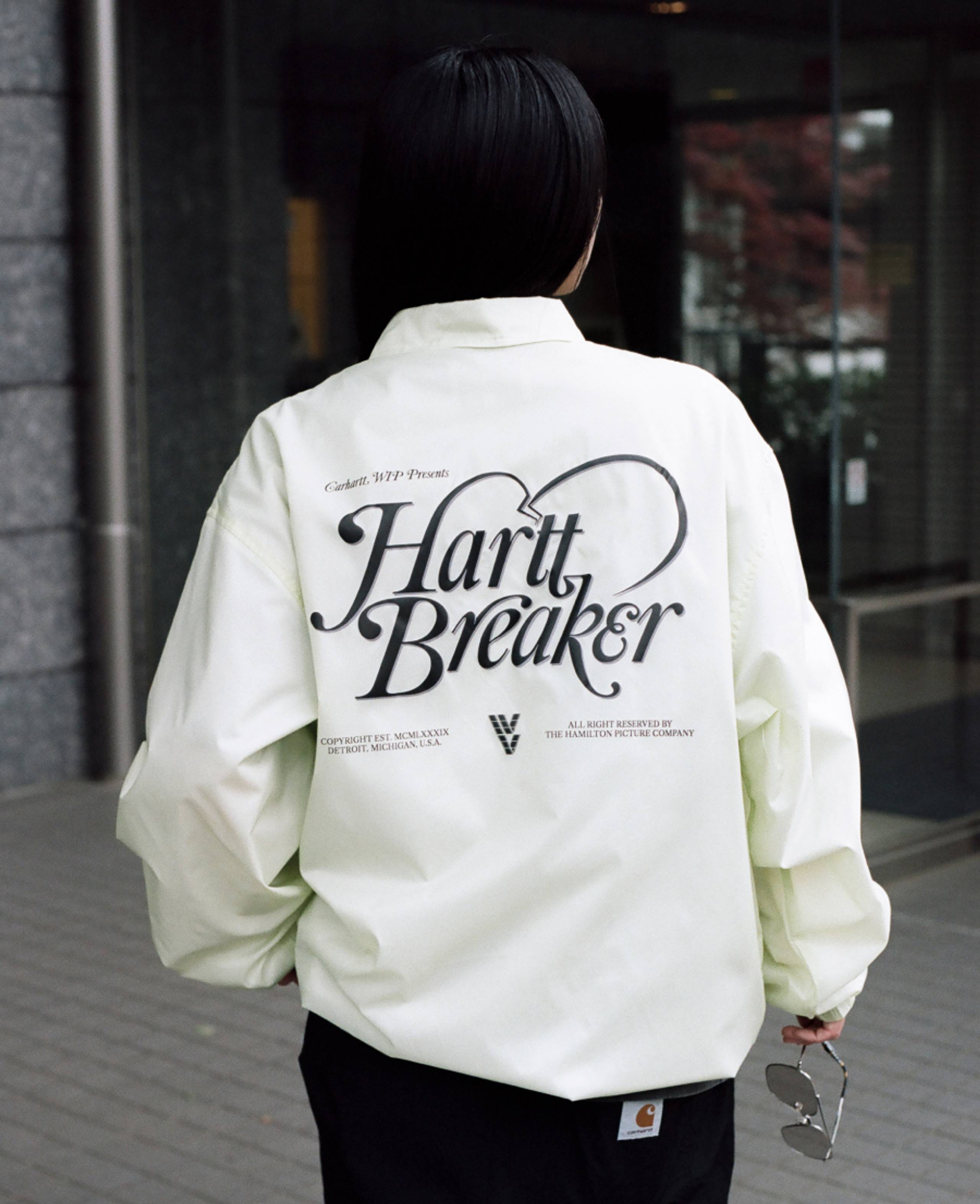 Model wearing a HarttBreaker Coach Jacket in Air Green