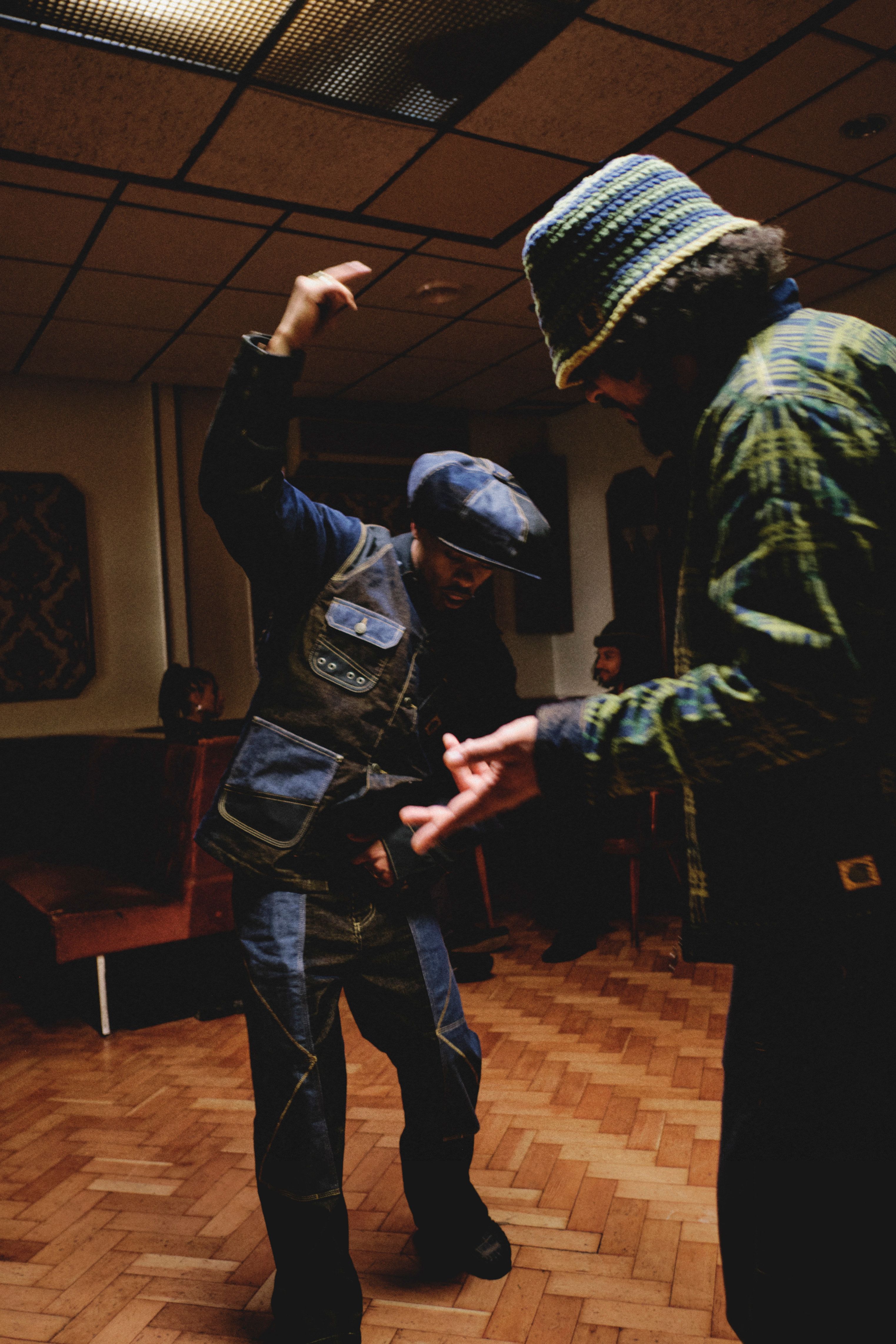 Models dancing while wearing items from the Nicholas Daley x Carhartt WIP Collaboration