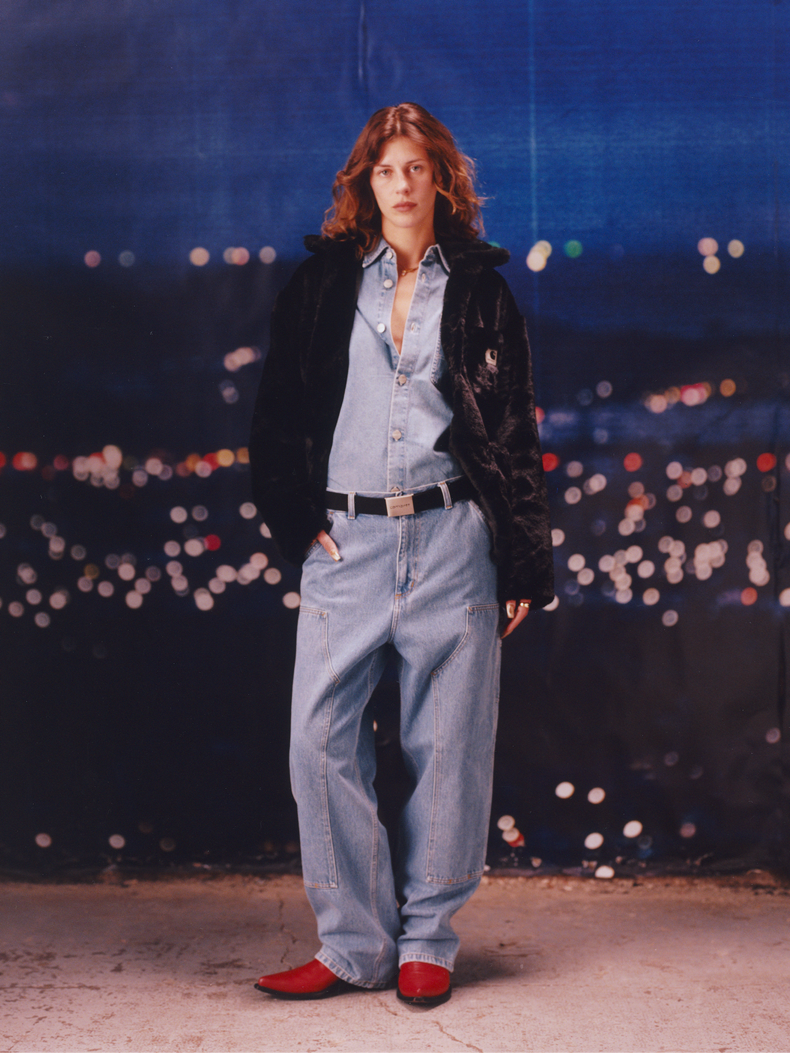 Model wearing a a full denim outfit and faux fur jacket in the Carhartt WIP F/W25 Women's Lookbook