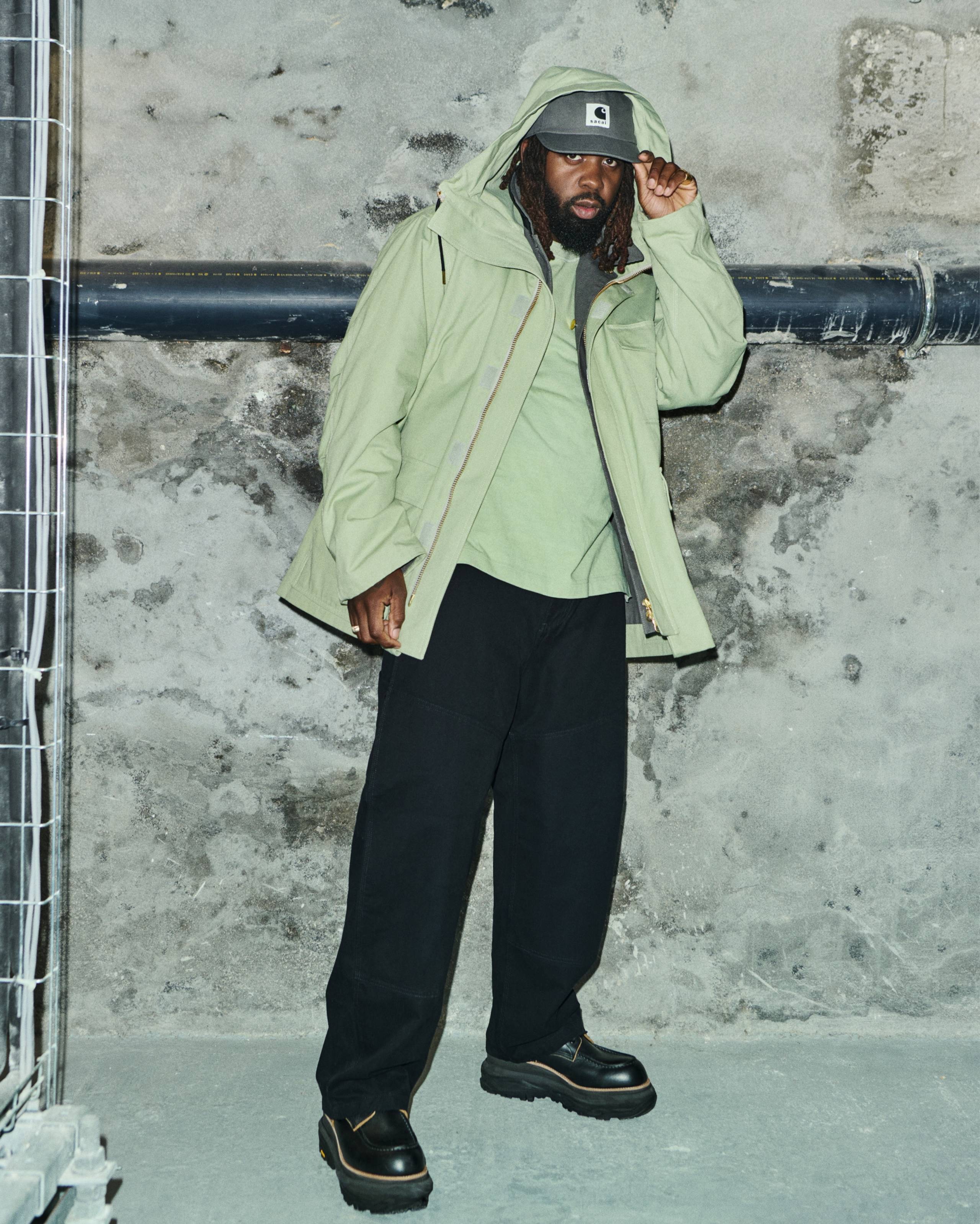 HiTech wearing items from the sacai x Carhartt WIP Collaboration