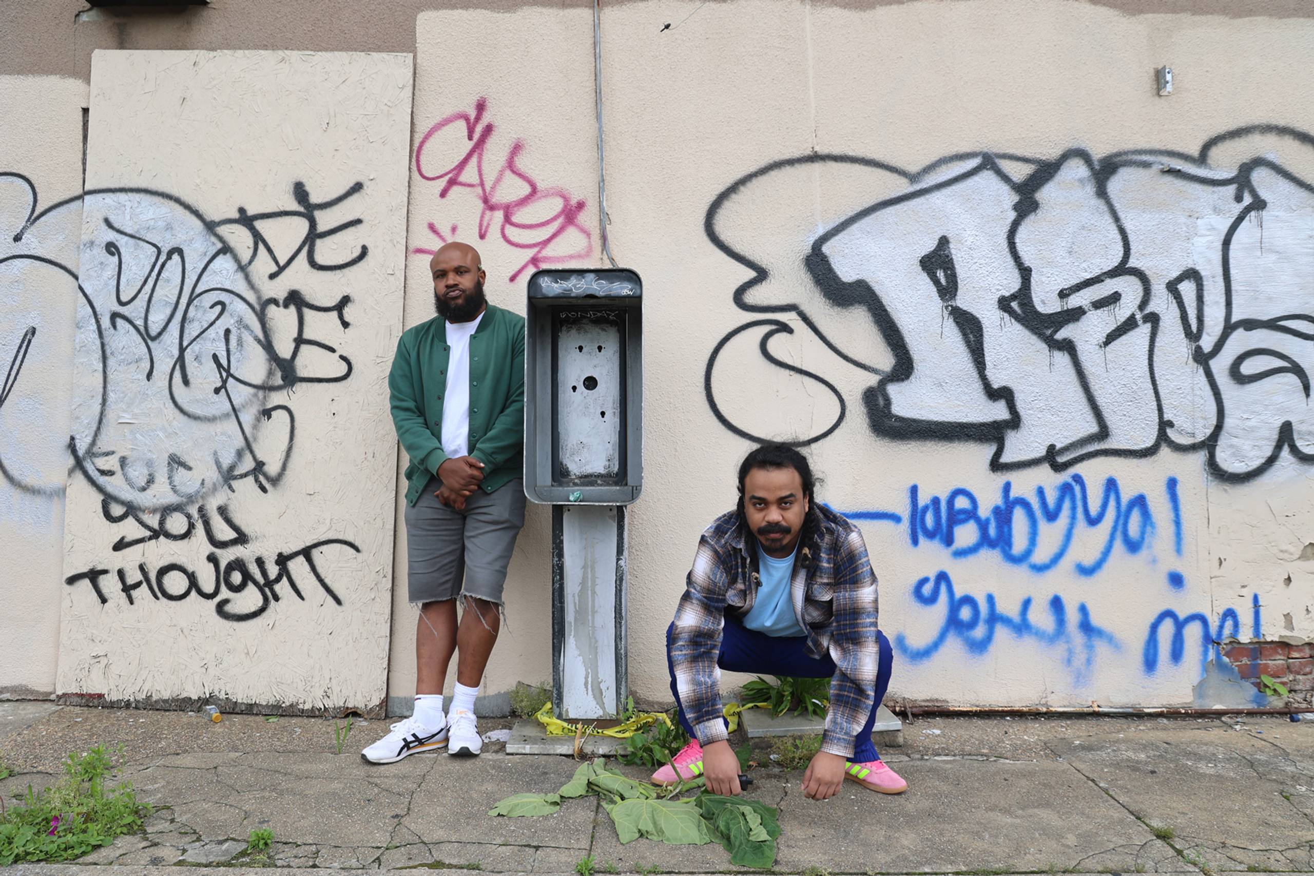 Infinity Knives posing near old telephone booth