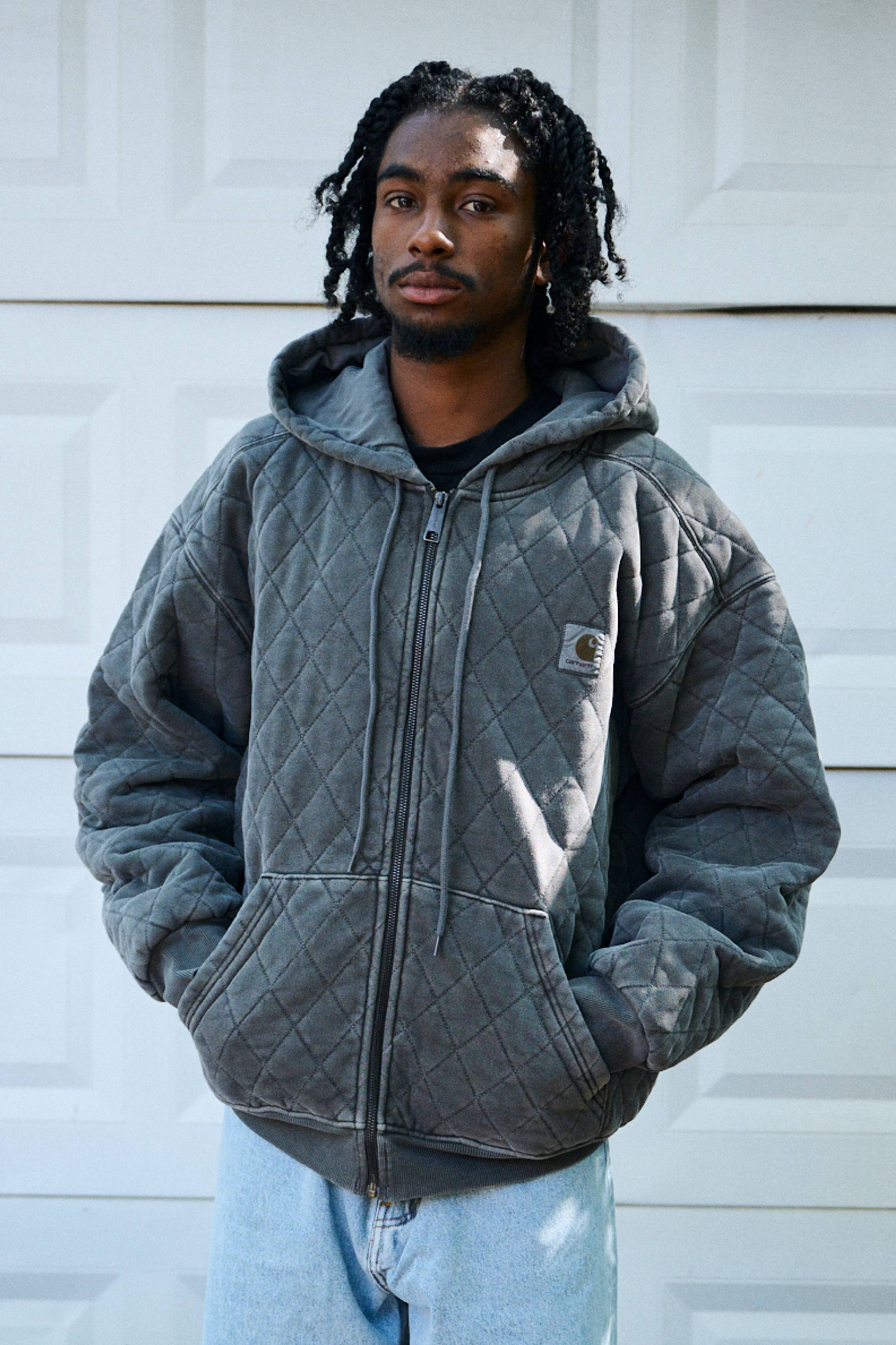 Model wearing a Hooded Vista Quilted Sweat Jacket in Black (Garment Dyed)
