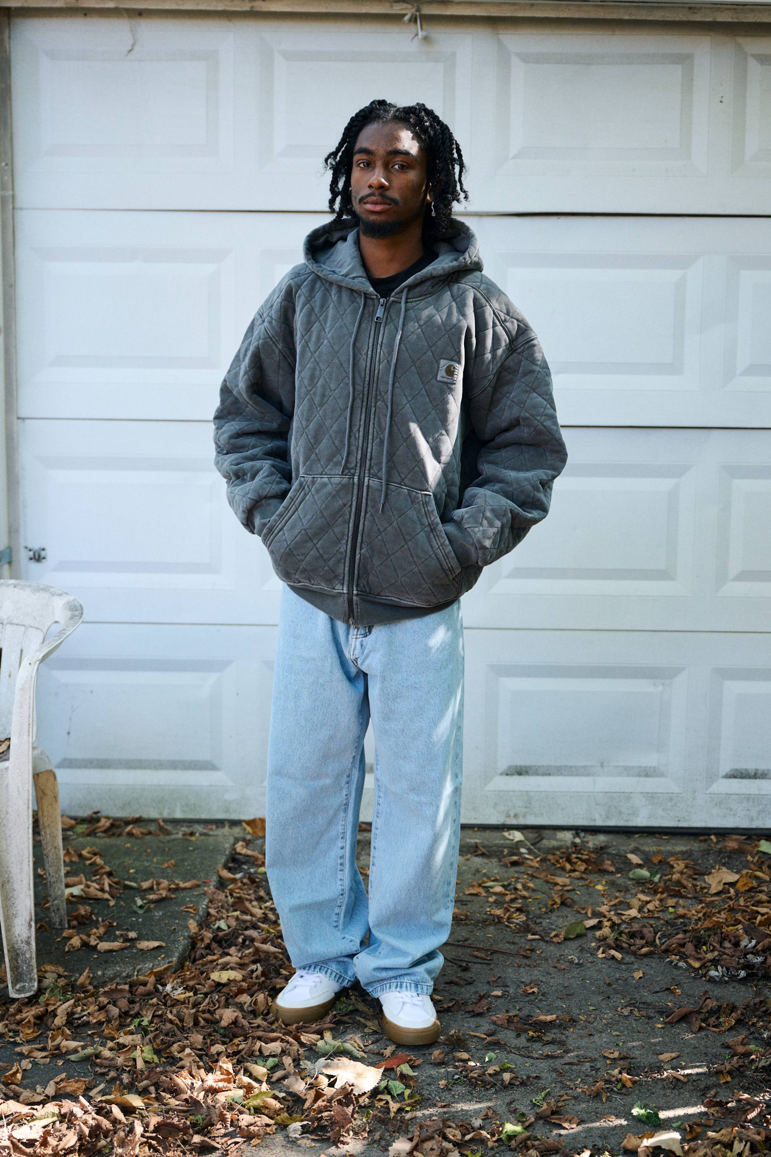 Model wearing a Hooded Vista Quilted Sweat Jacket in Black (Garment Dyed)