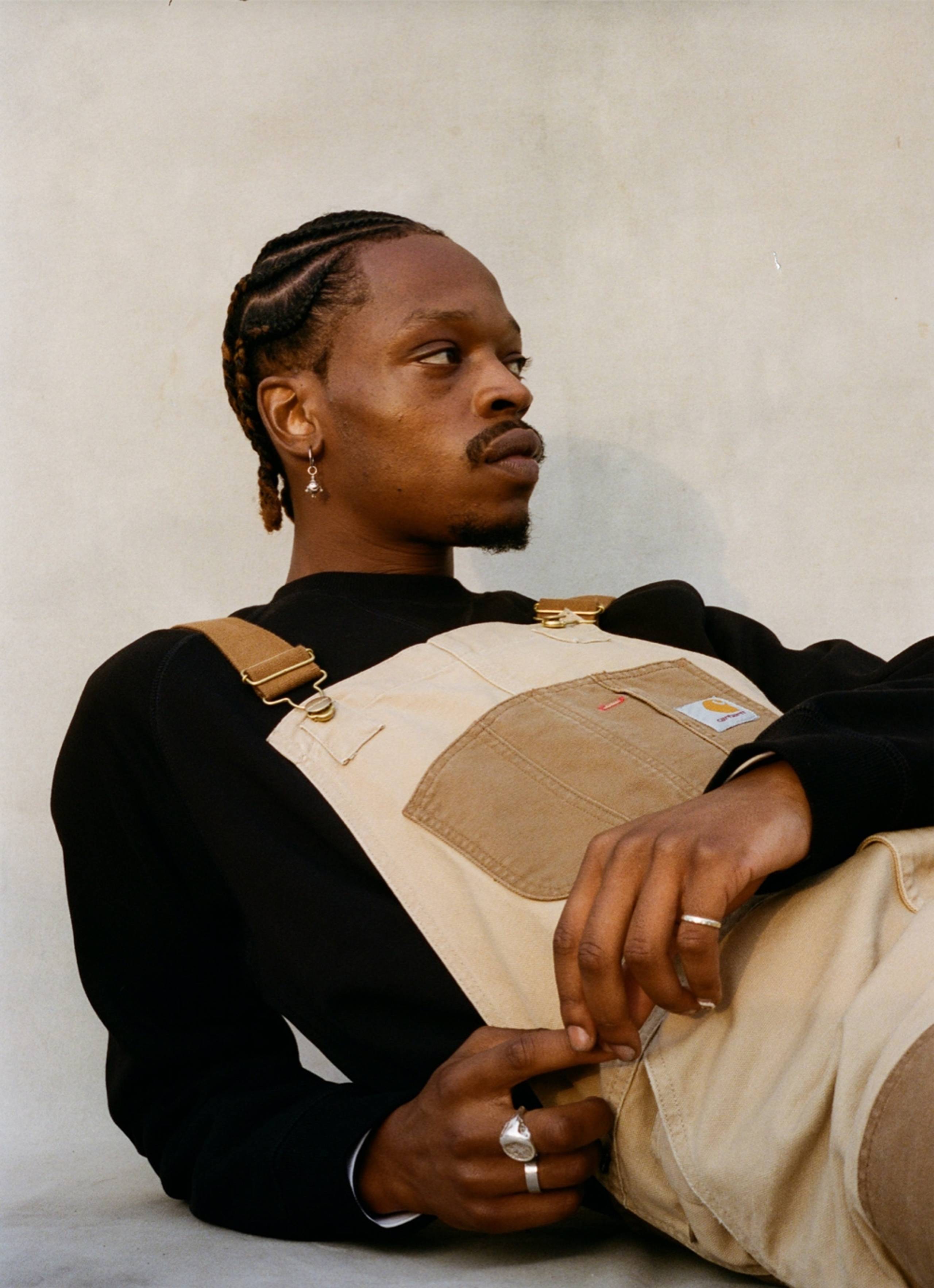Model Model wearing Carhartt WIP Double Knee Bib Overall in Two Tone Dusty Hamilton Brown