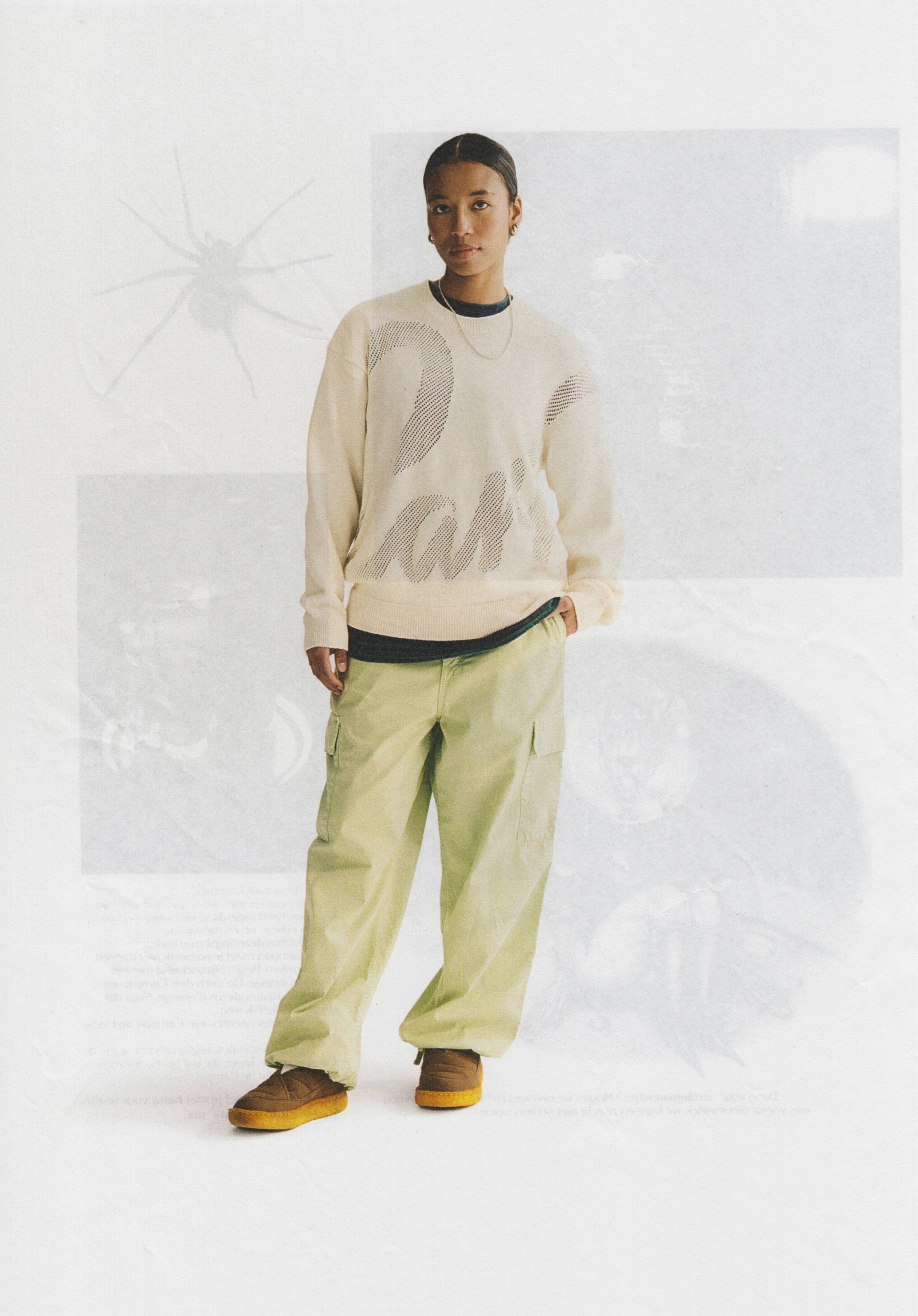 Model wearing Carhartt WIP Kingston Cargo Pants in Pale Olive