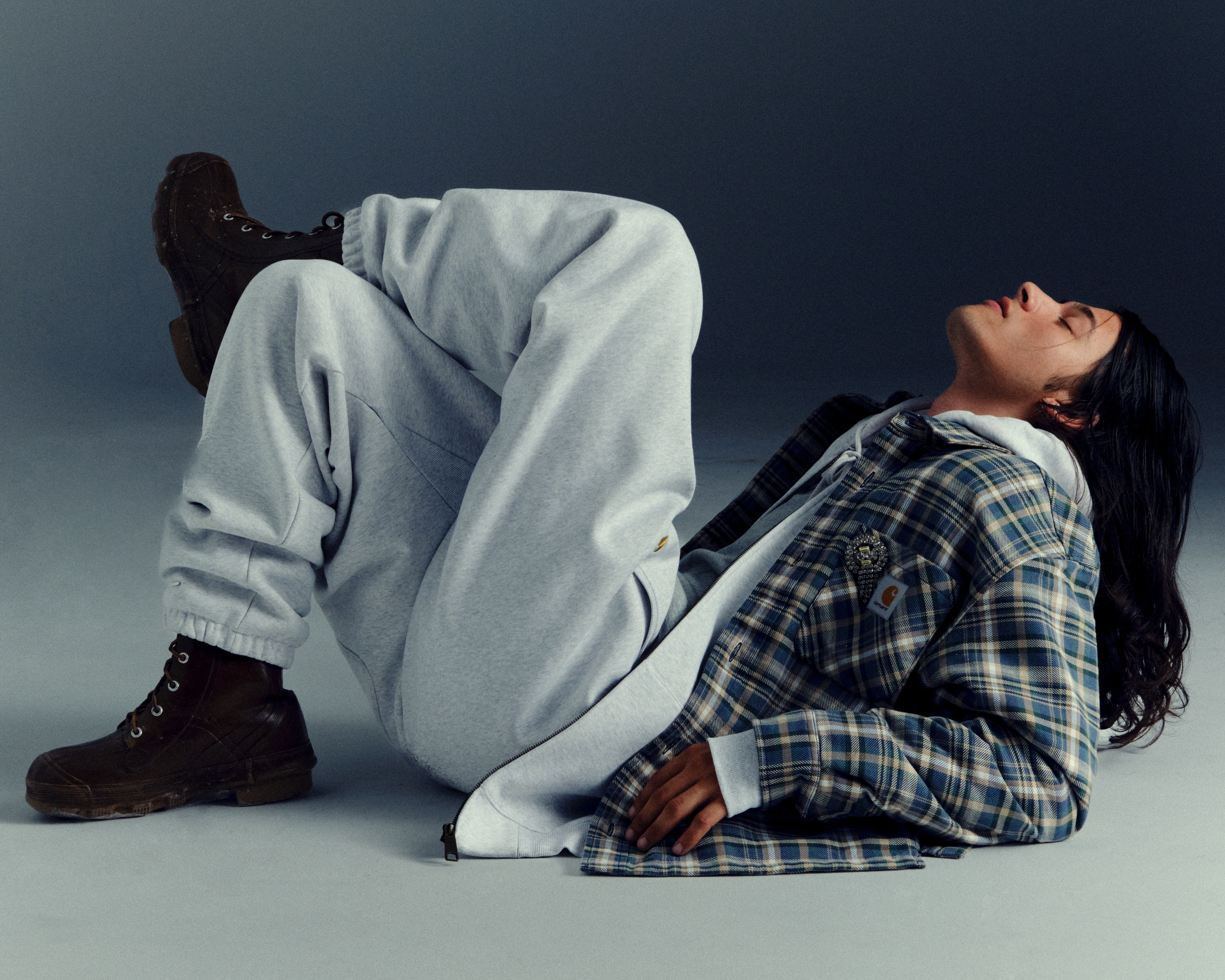 Model leaned back wearing items from the Carhartt WIP Fall/Winter 2025 Icons Shoot