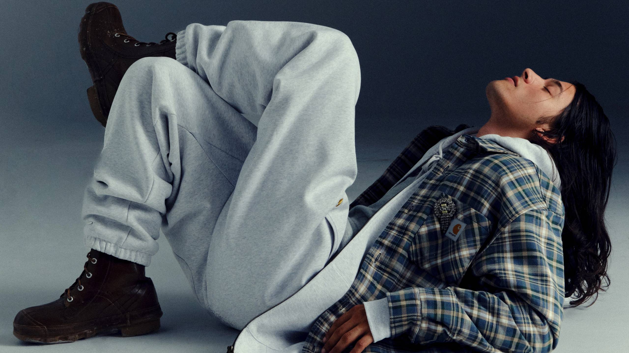Model leaned back wearing items from the Carhartt WIP Fall/Winter 2025 Icons Shoot