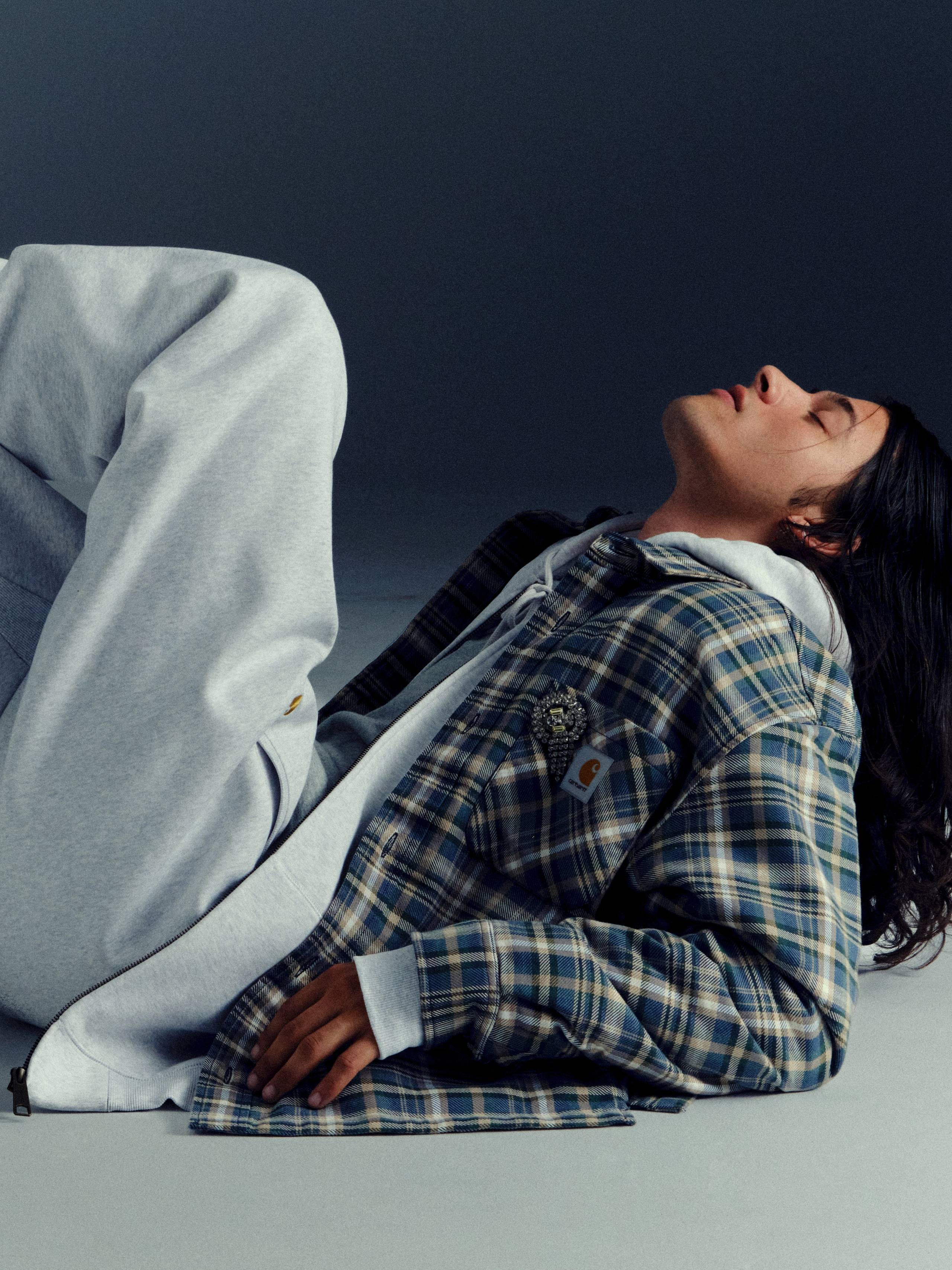 Model leaned back wearing items from the Carhartt WIP Fall/Winter 2025 Icons Shoot