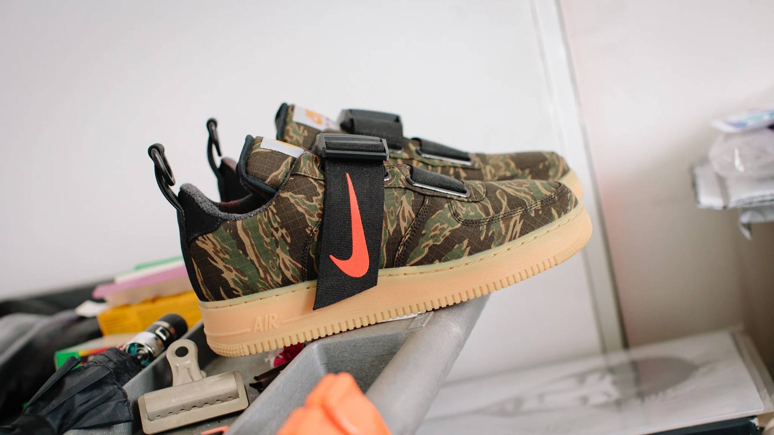 Carhartt WIP x Nike Air Force One Utility in Camo on a work bench