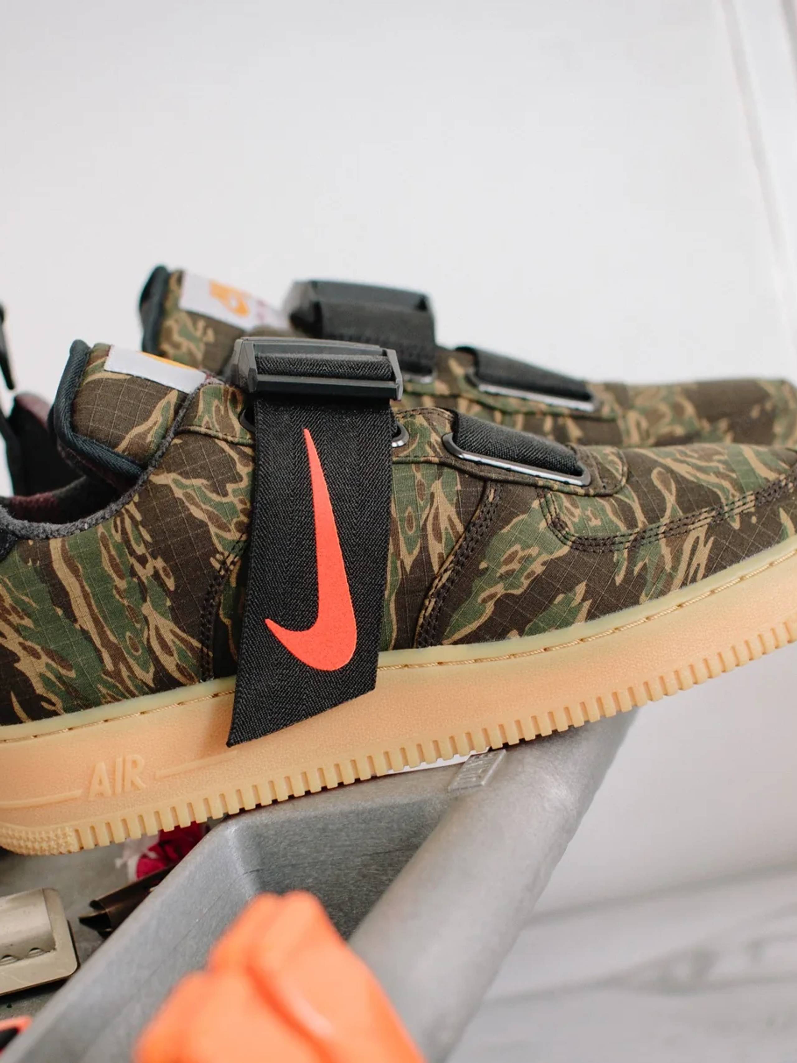 Carhartt WIP x Nike Air Force One Utility in Camo on a work bench