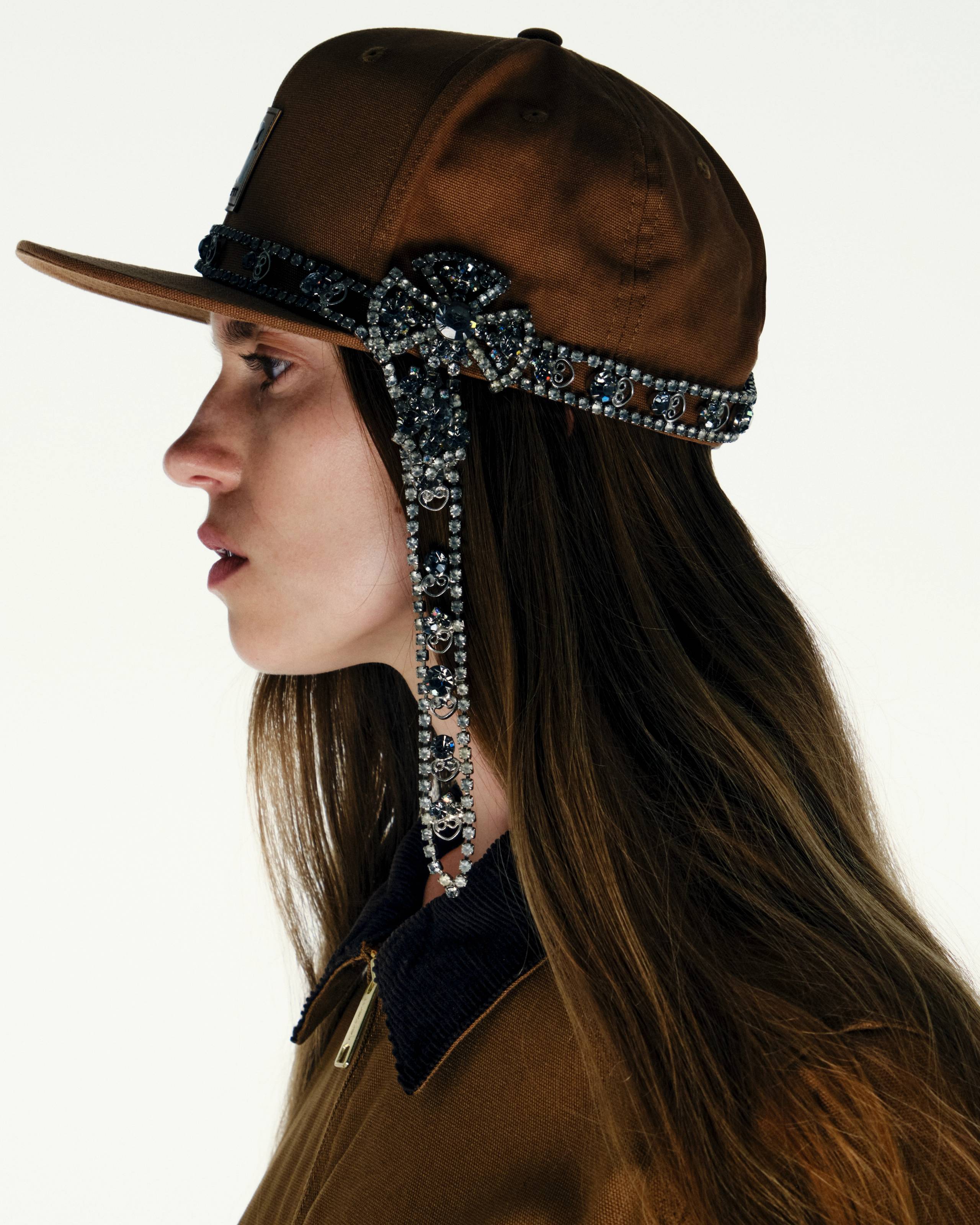 Model wearing a Logo Cap in Hamilton Brown with a Belt tied around it