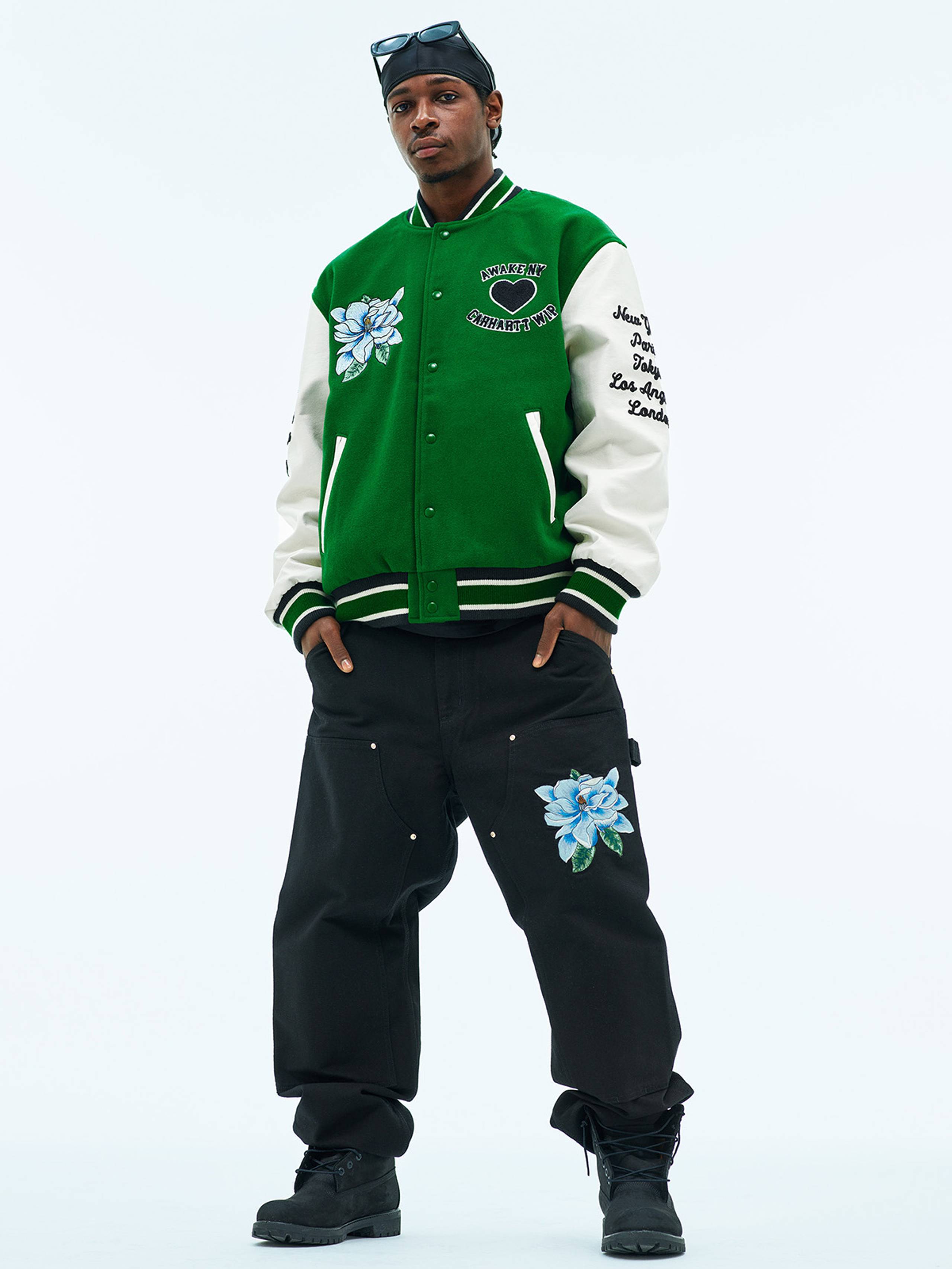 Model wearing Carhartt WIP x Awake NY Varsity Jacket in Green