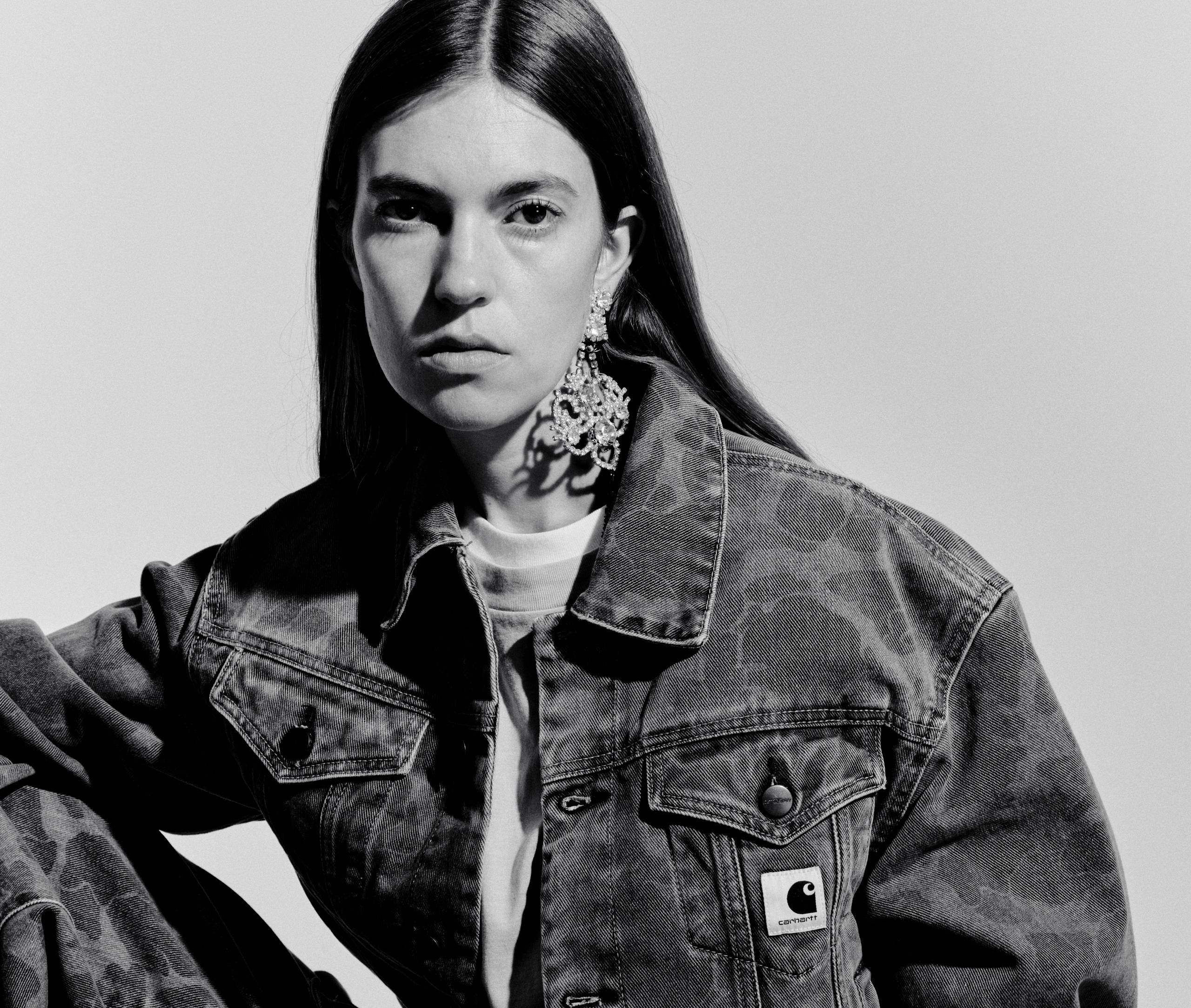 Black and White image of Model wearing a Women’s Duck Orell Jacket and Duck Orell Pant