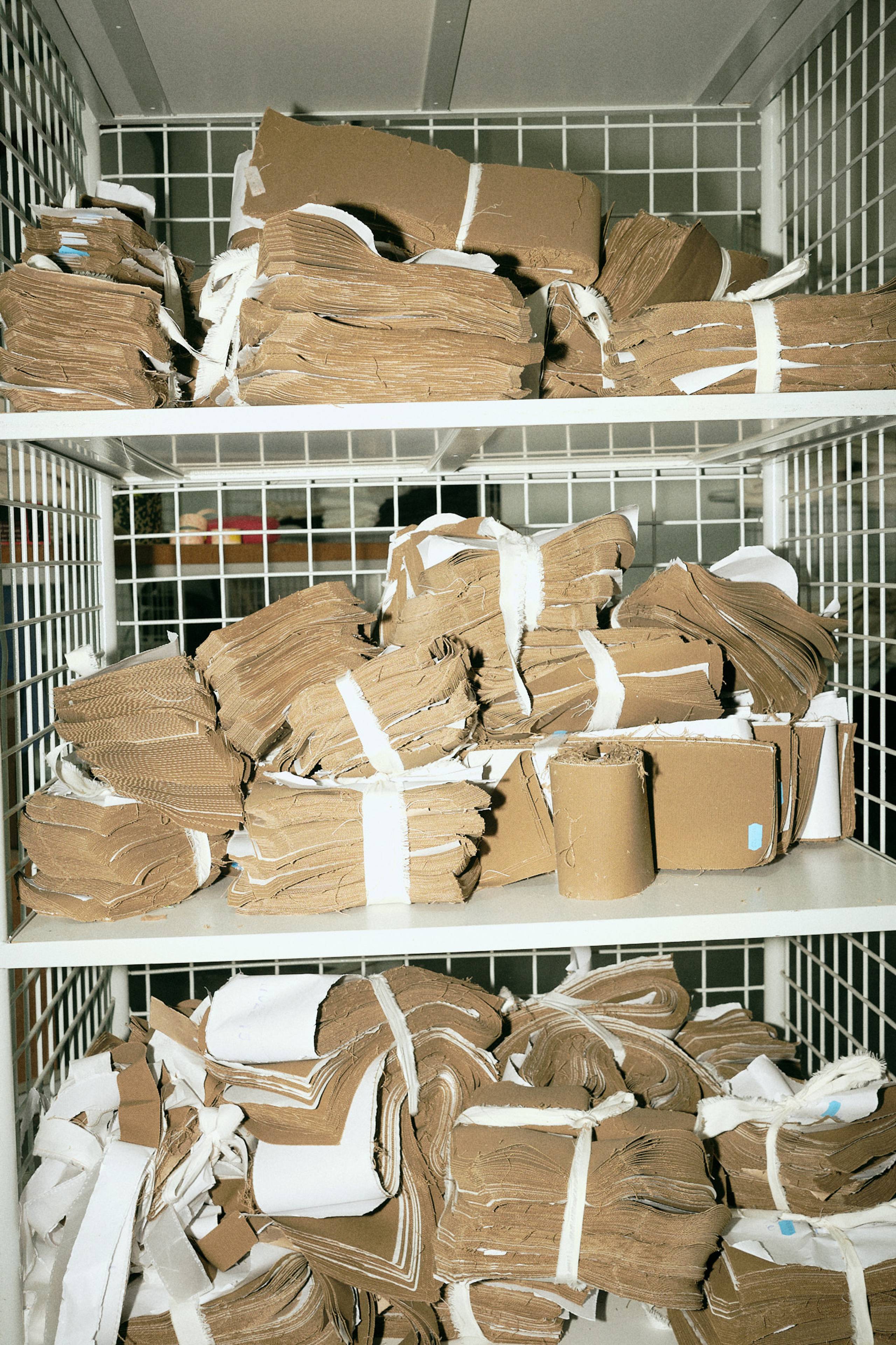 Stacks of Carhartt WIP hamilton brown fabric in factory