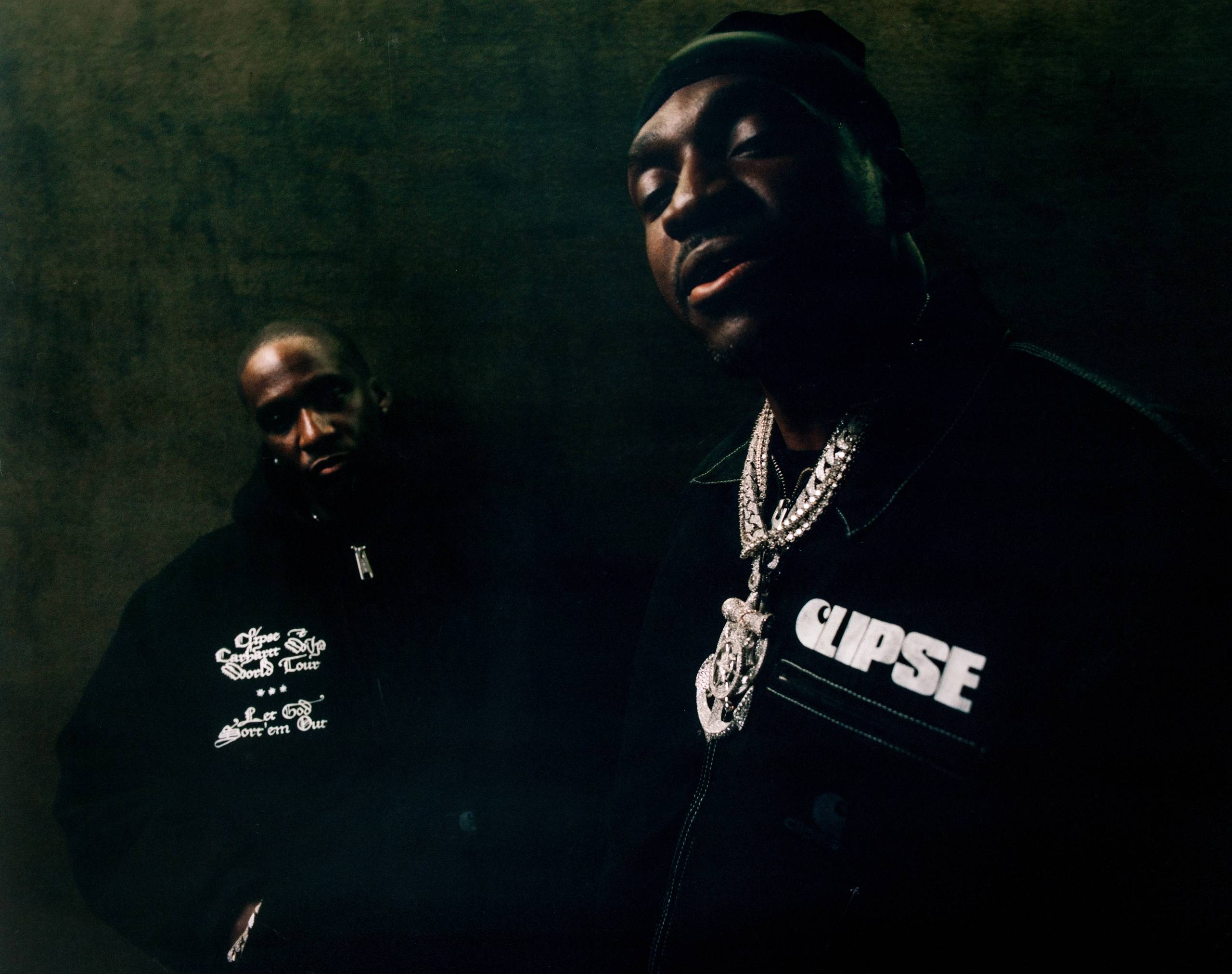 Artist Pusha T and Malice pose wearing items from the Carhartt WIP x CLIPSE collab