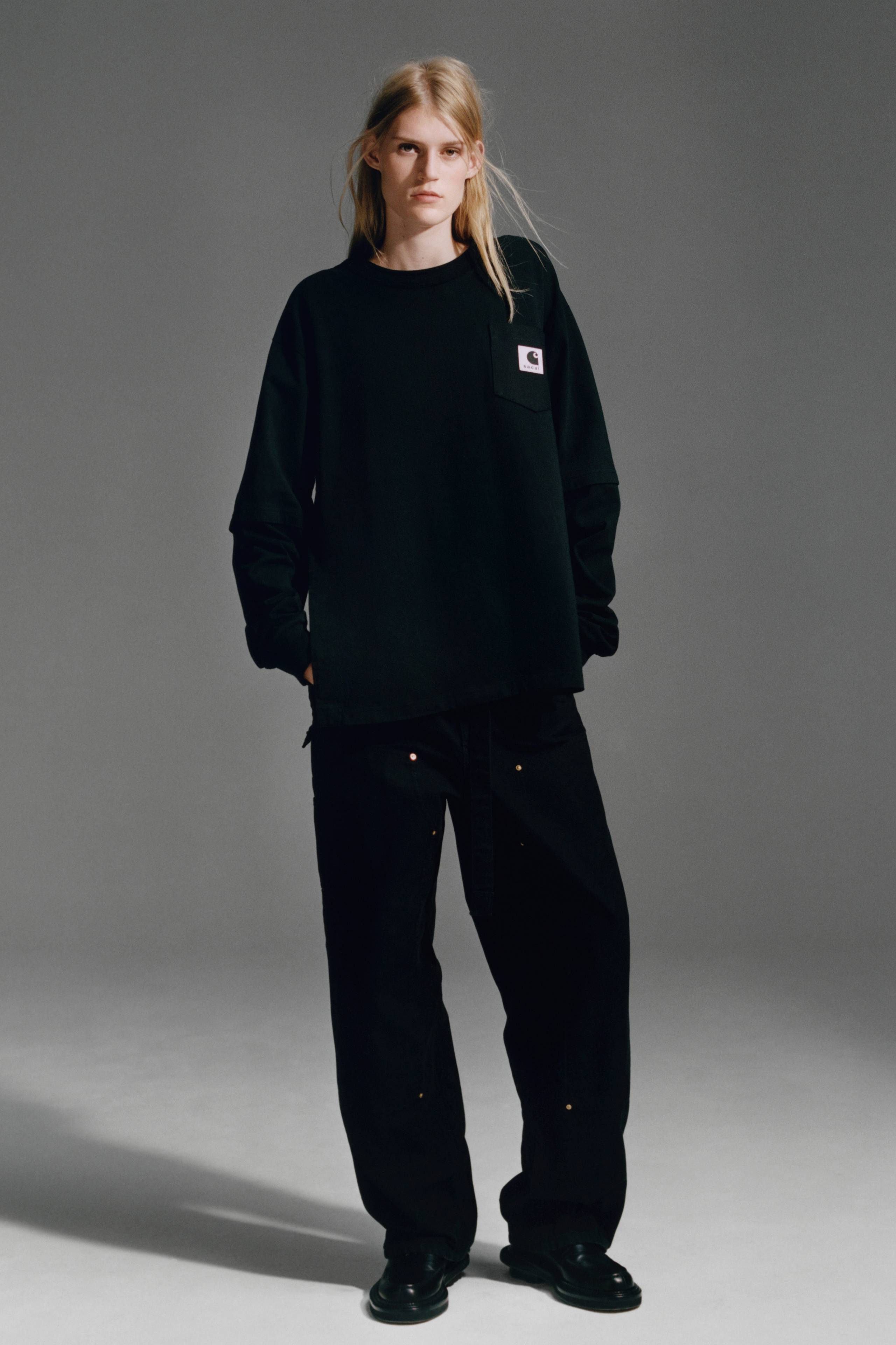 person wearing a longsleeve sacai x Carhartt WIP shirt