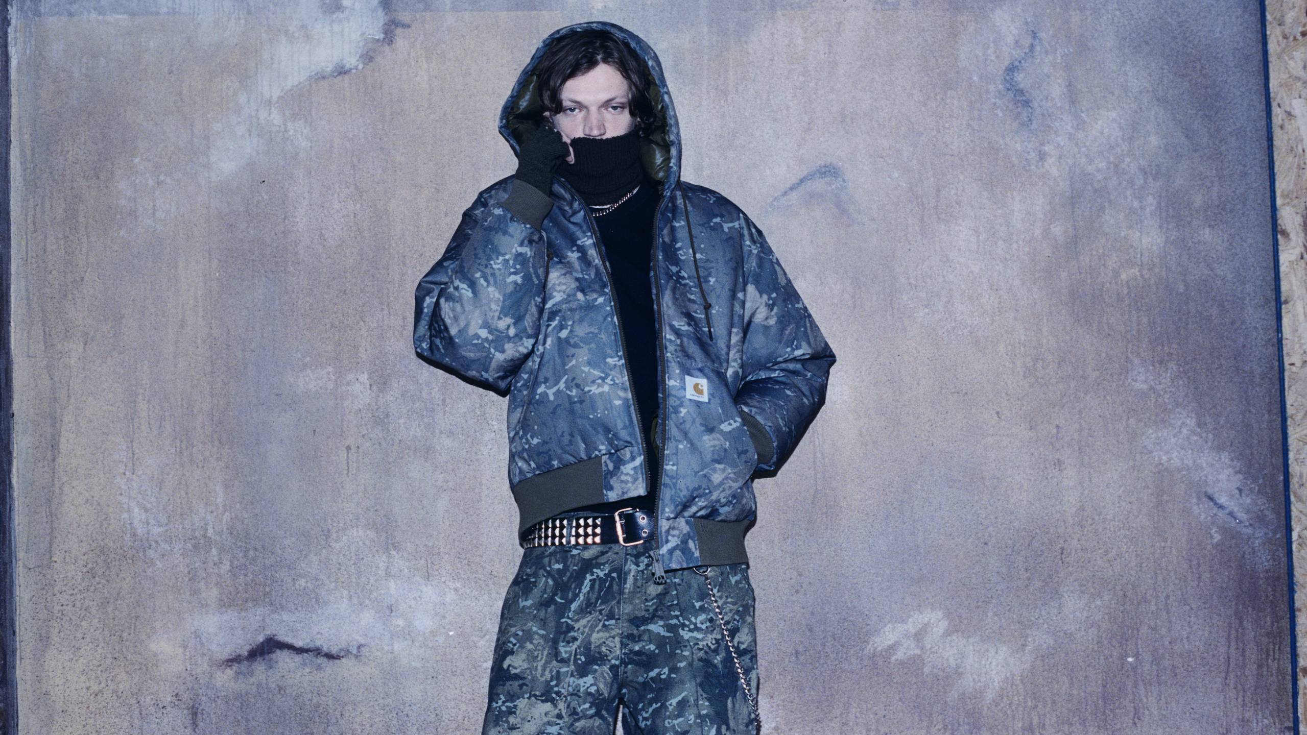 Model wearing a full Camo Combi look from the In Plain Sight Collection