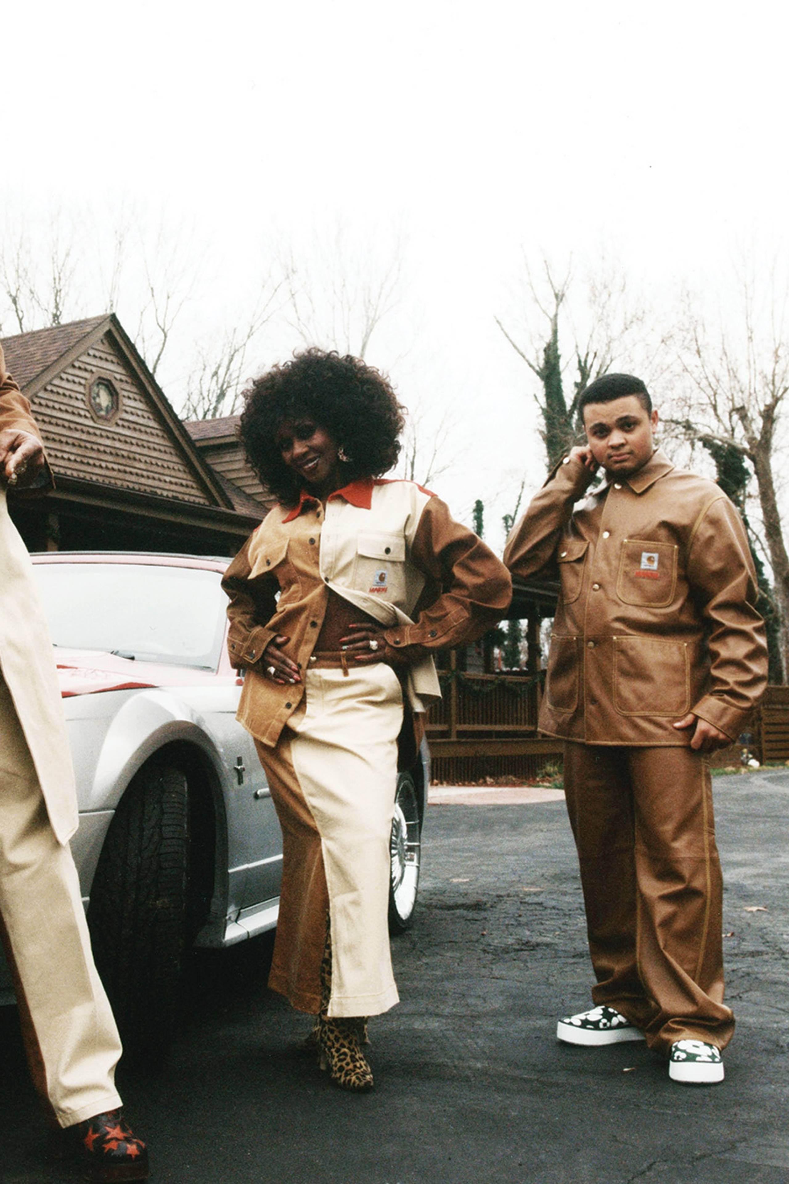 3 Models wearing MARNI x Carhartt WIP next to a car
