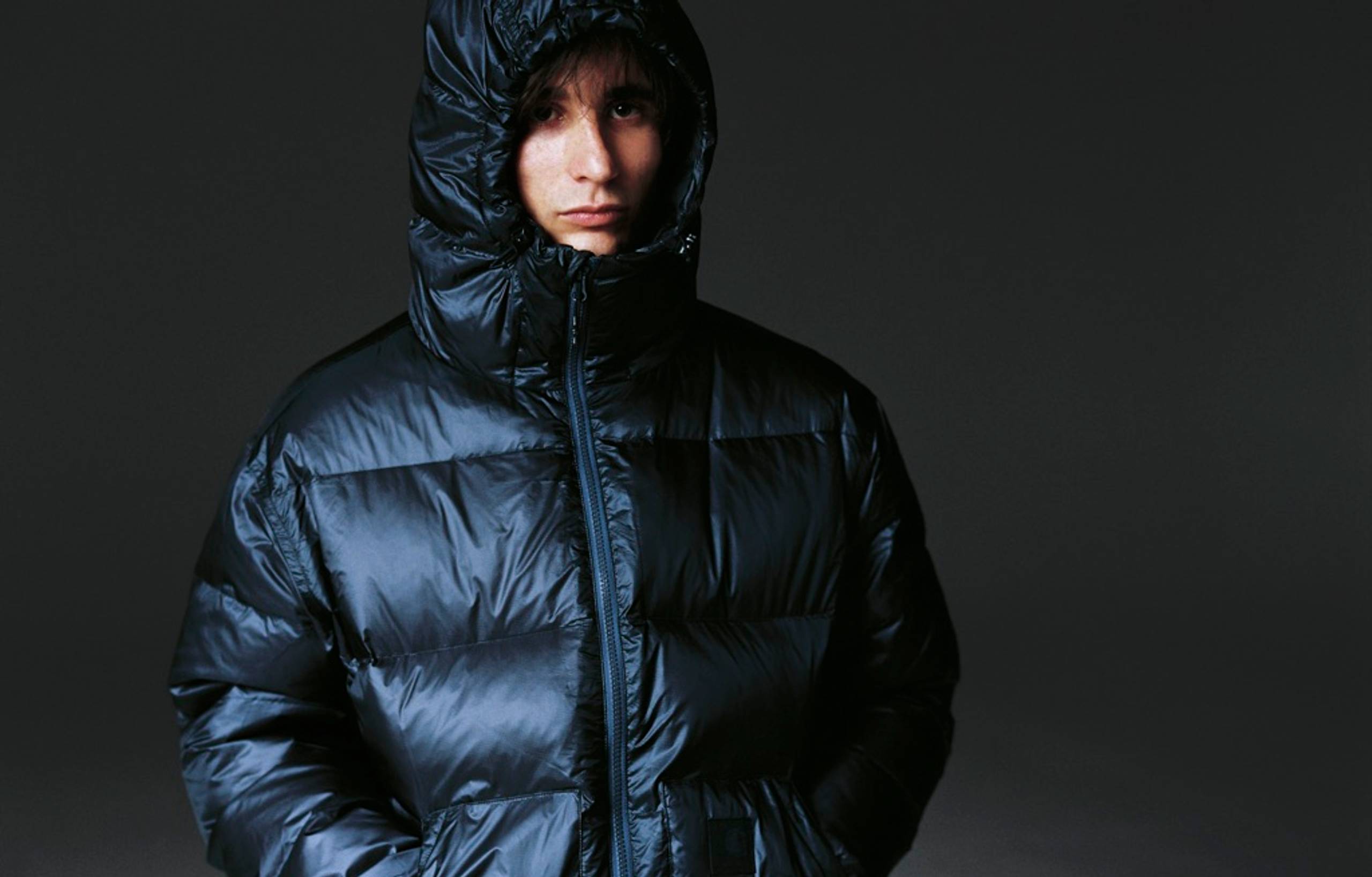 Model wearing a Lucid Jacket in Charcoal Grey