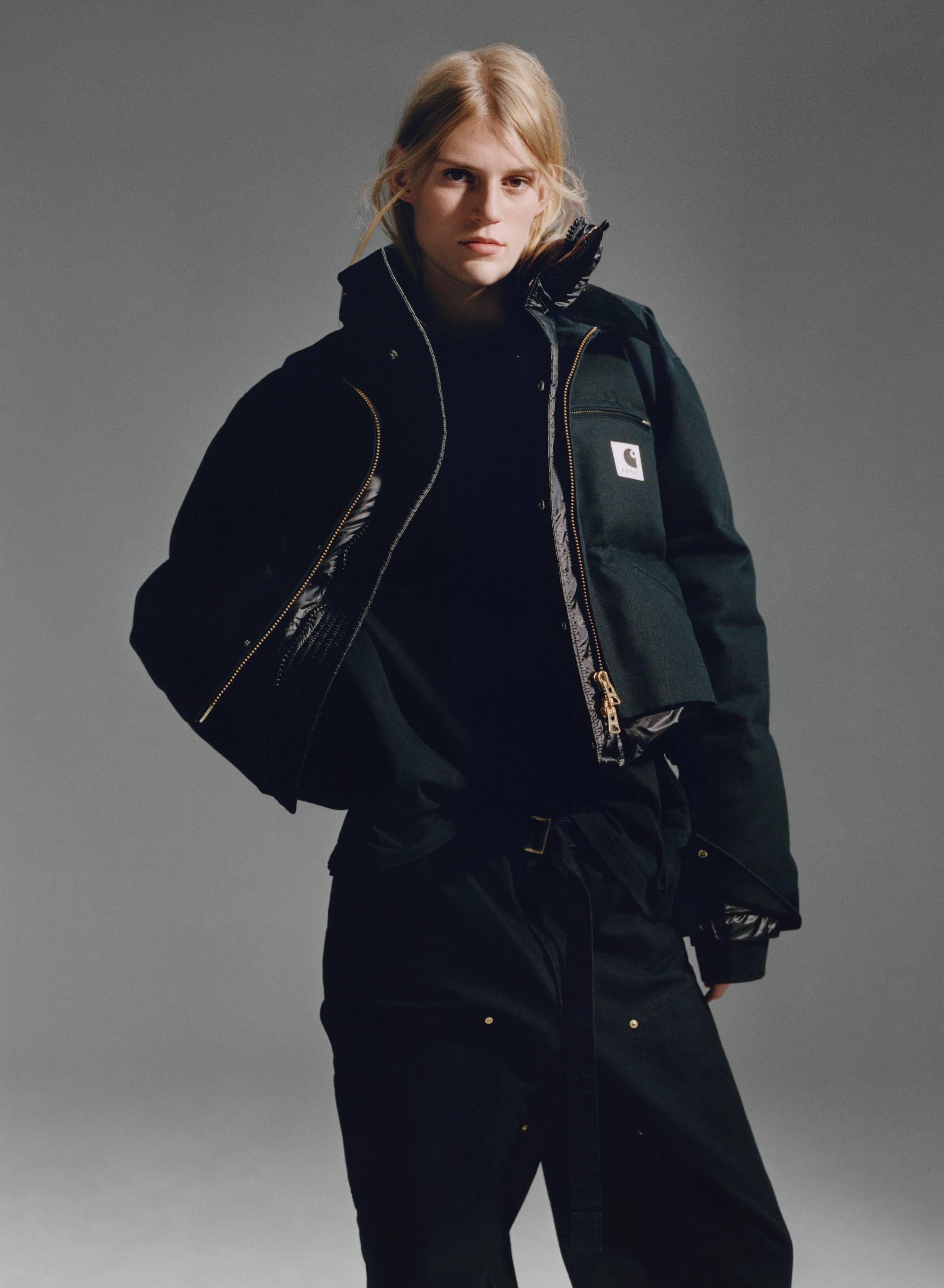 person wearing a sacai x Carhartt WIP jacket and pants