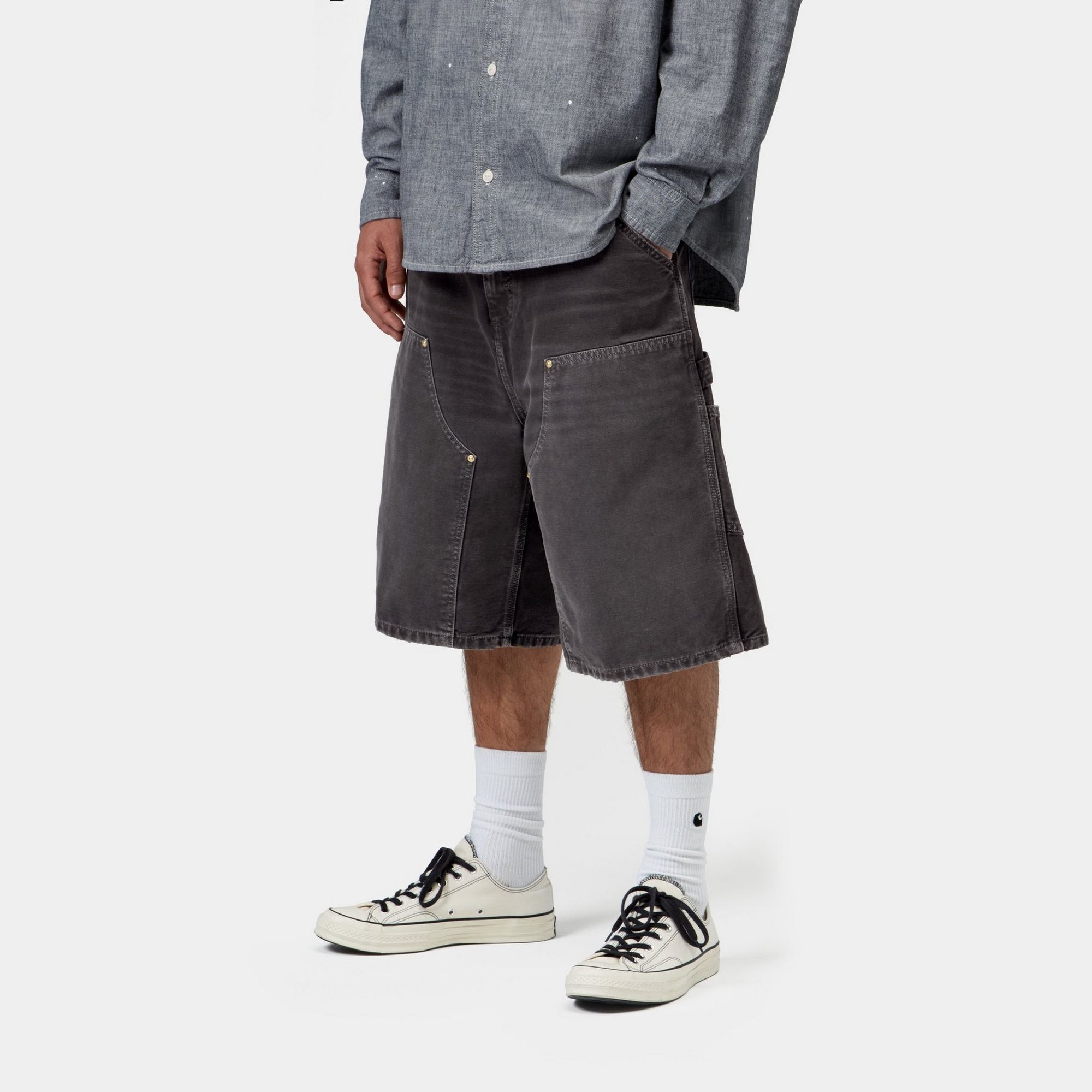 Model wearing a pair of OG Double Knee Short in Black