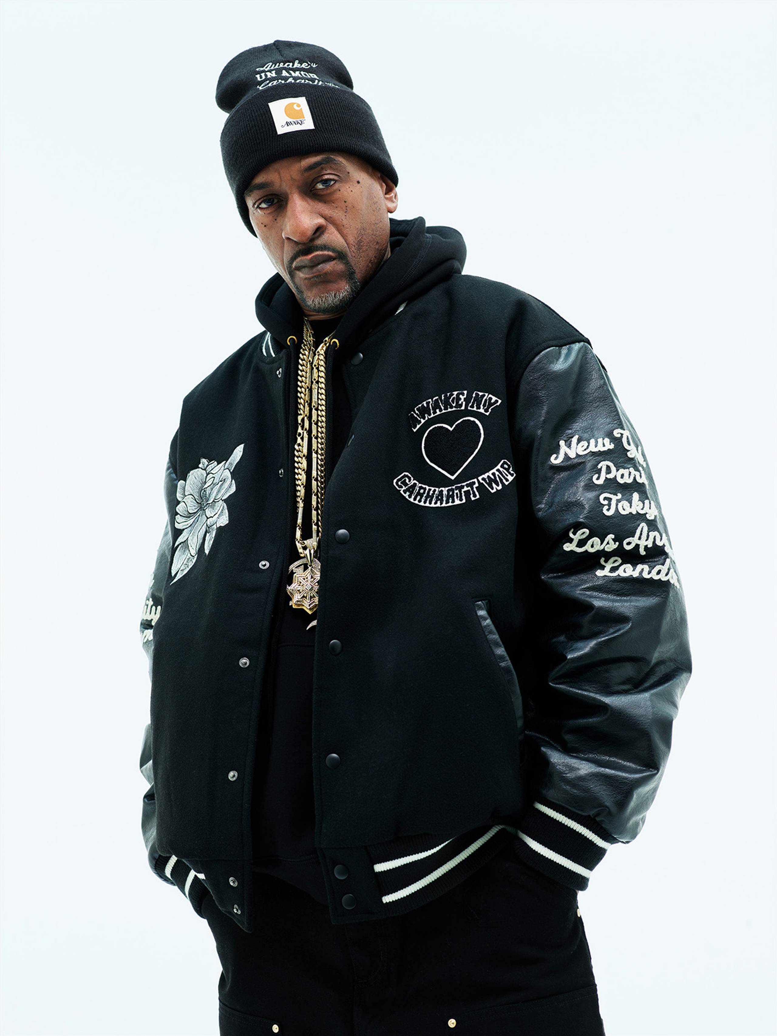 Model wearing Carhartt WIP x Awake NY Varsity Jacket in Black