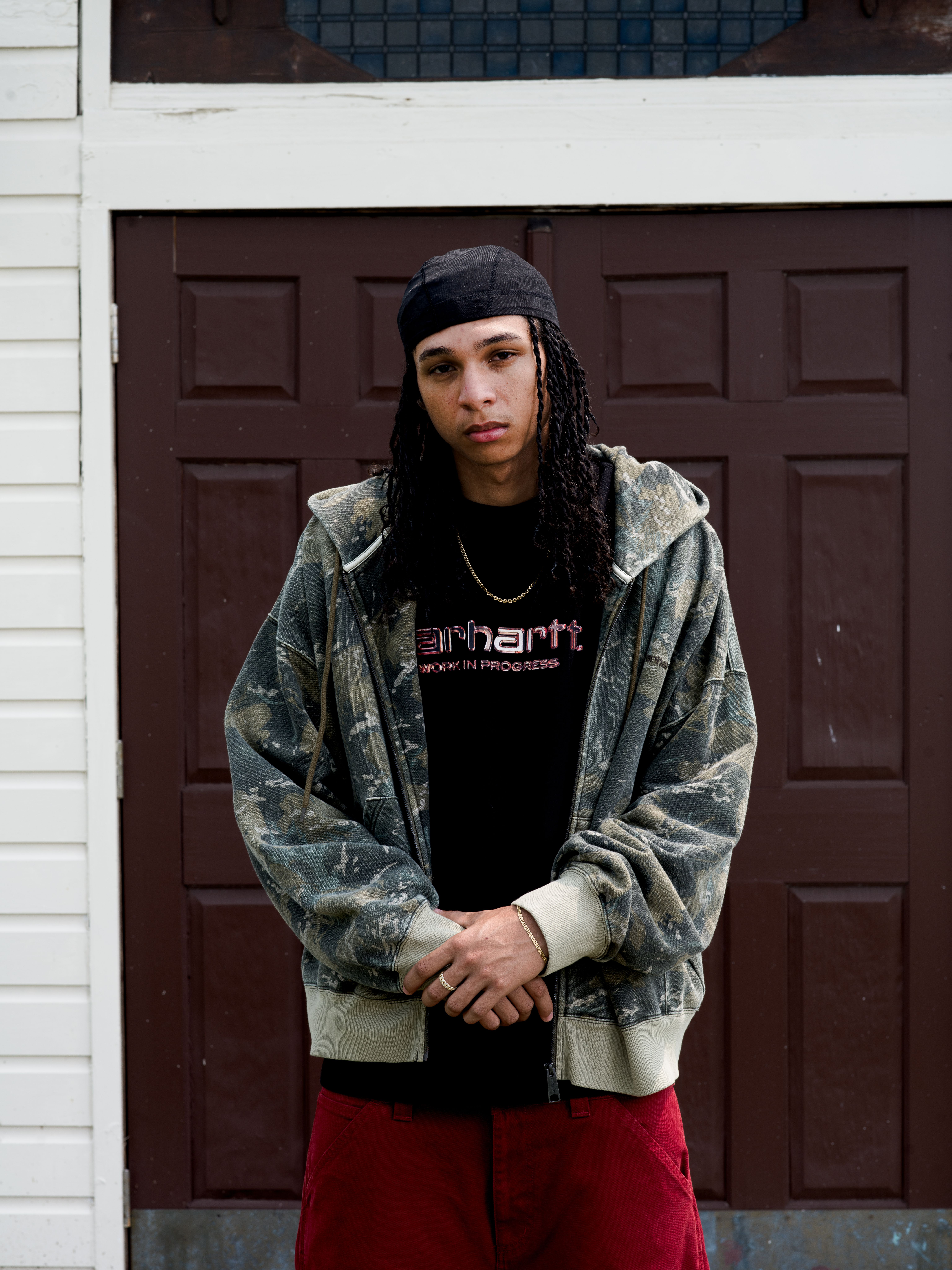 Model wearing a Hooded Benton Sweatshirt in Green Camo Combi