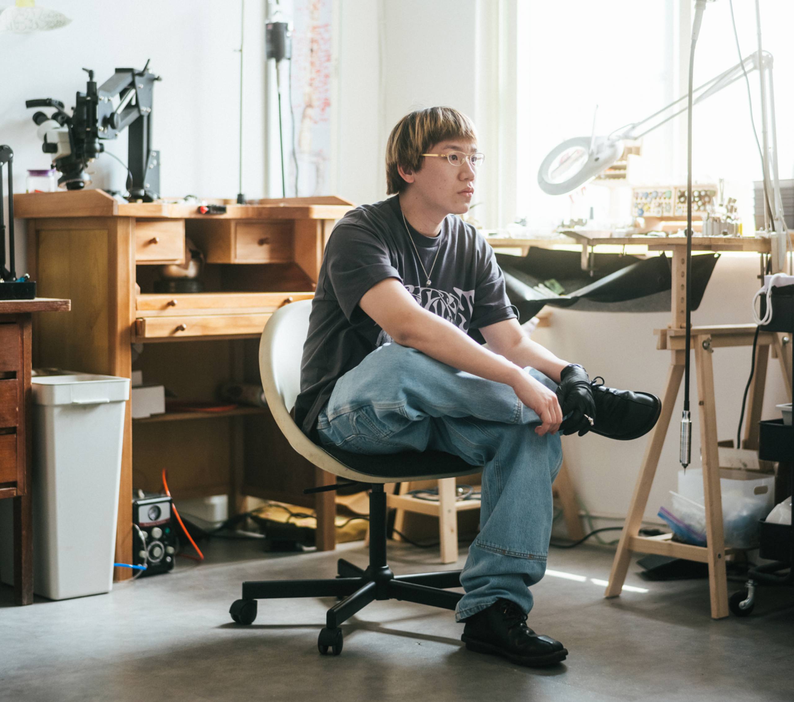 Jewelry Designer Eric Wu working in his design studio