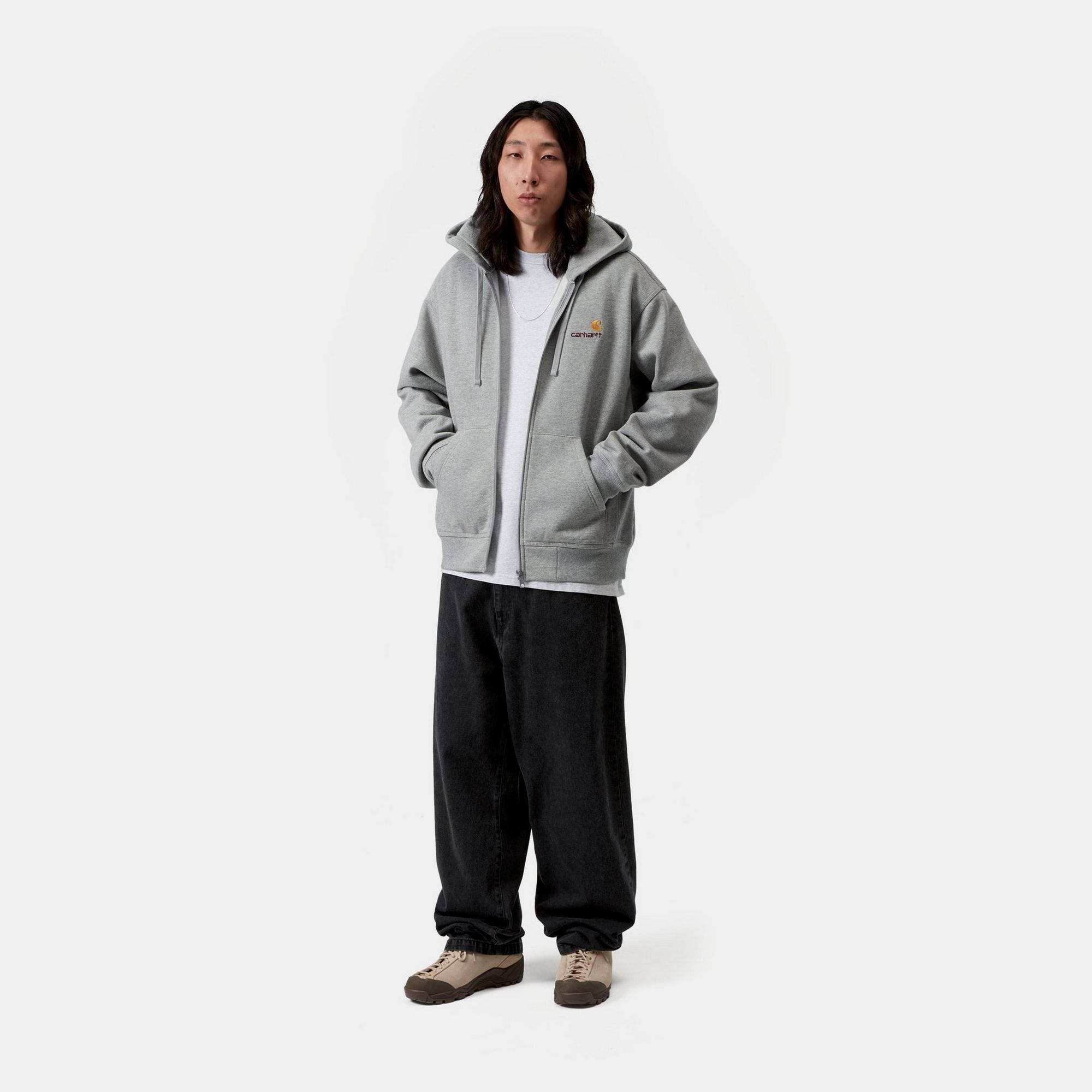 Model wearing a pair of Carhartt WIP Brandon Pants in Black