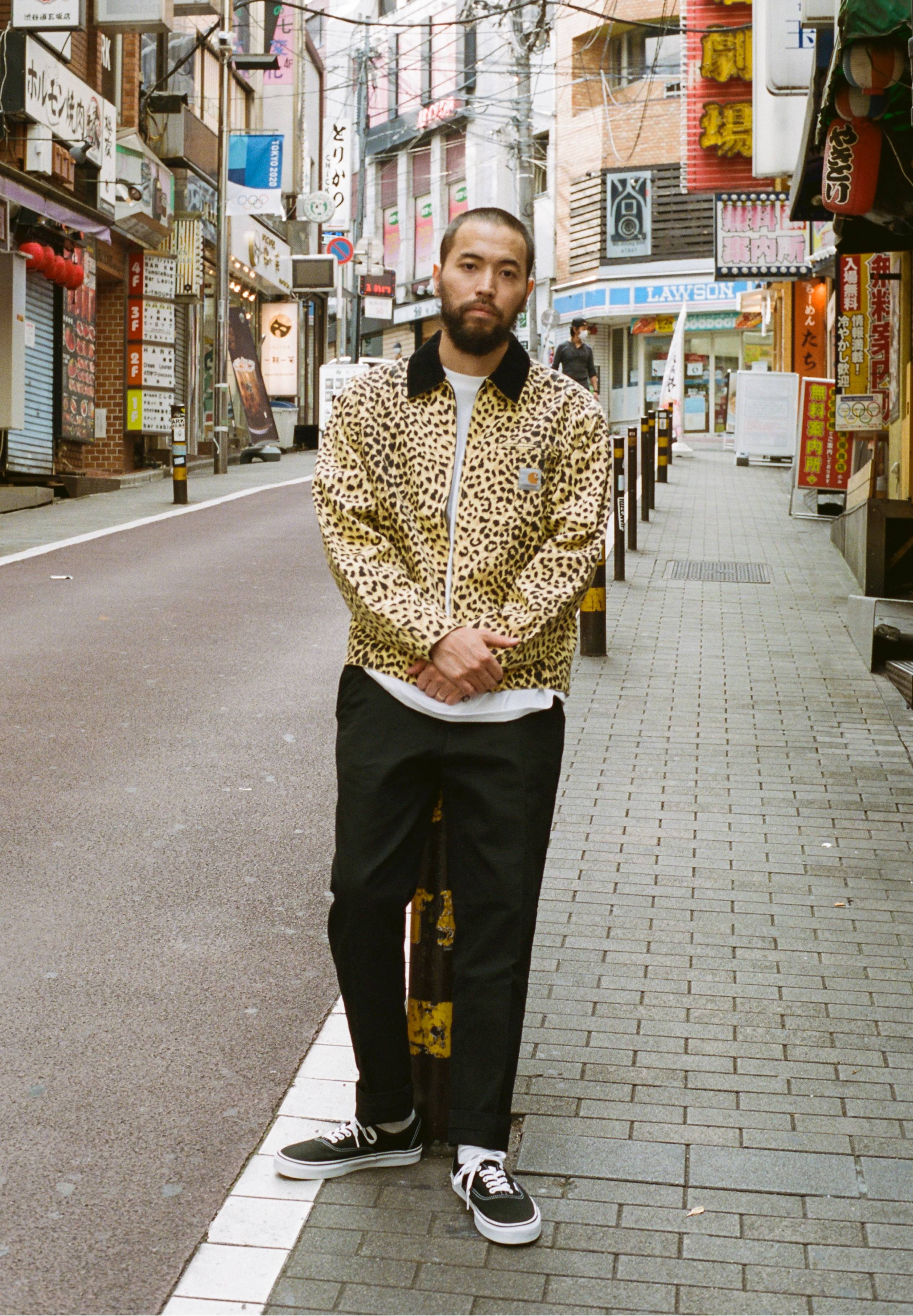 Model standing on street wearing items from Carhartt WIP x Wacko Maria collab