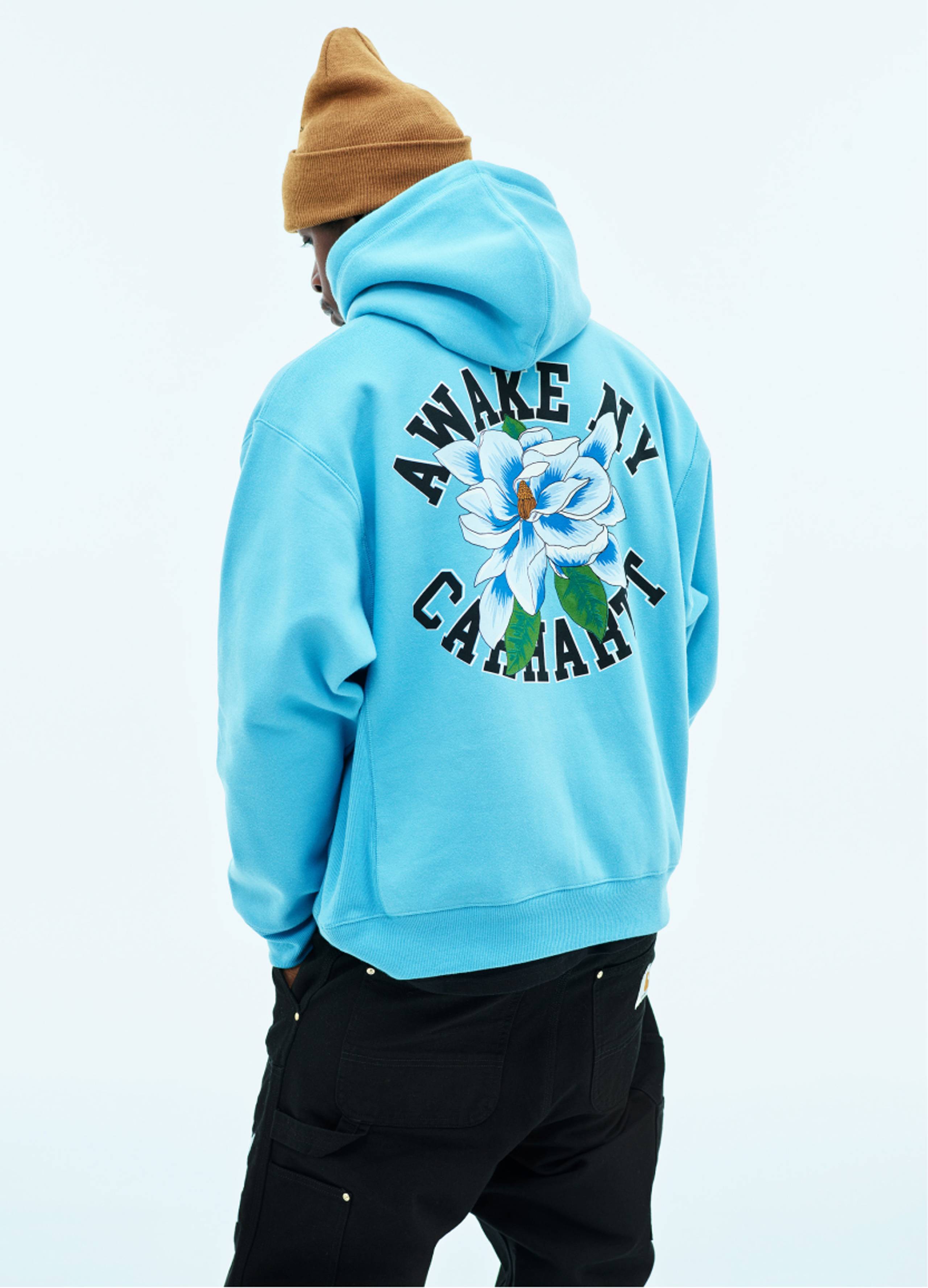 Model wearing Carhartt WIP x Awake NY Hoodie in Blue