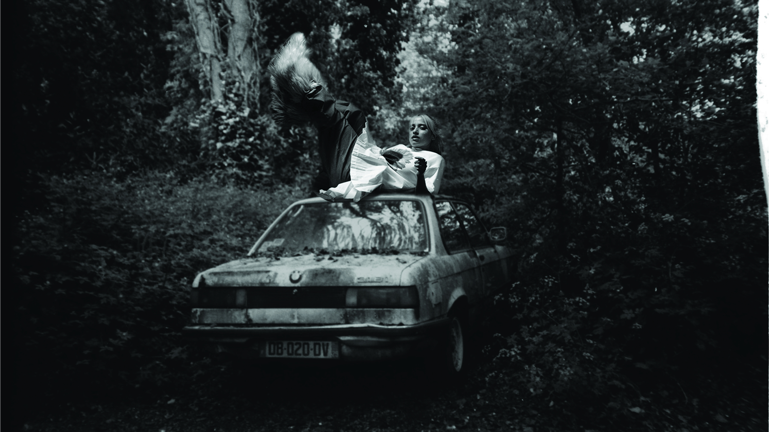 Lea Sen sitting on a car in WIP Magazine Article