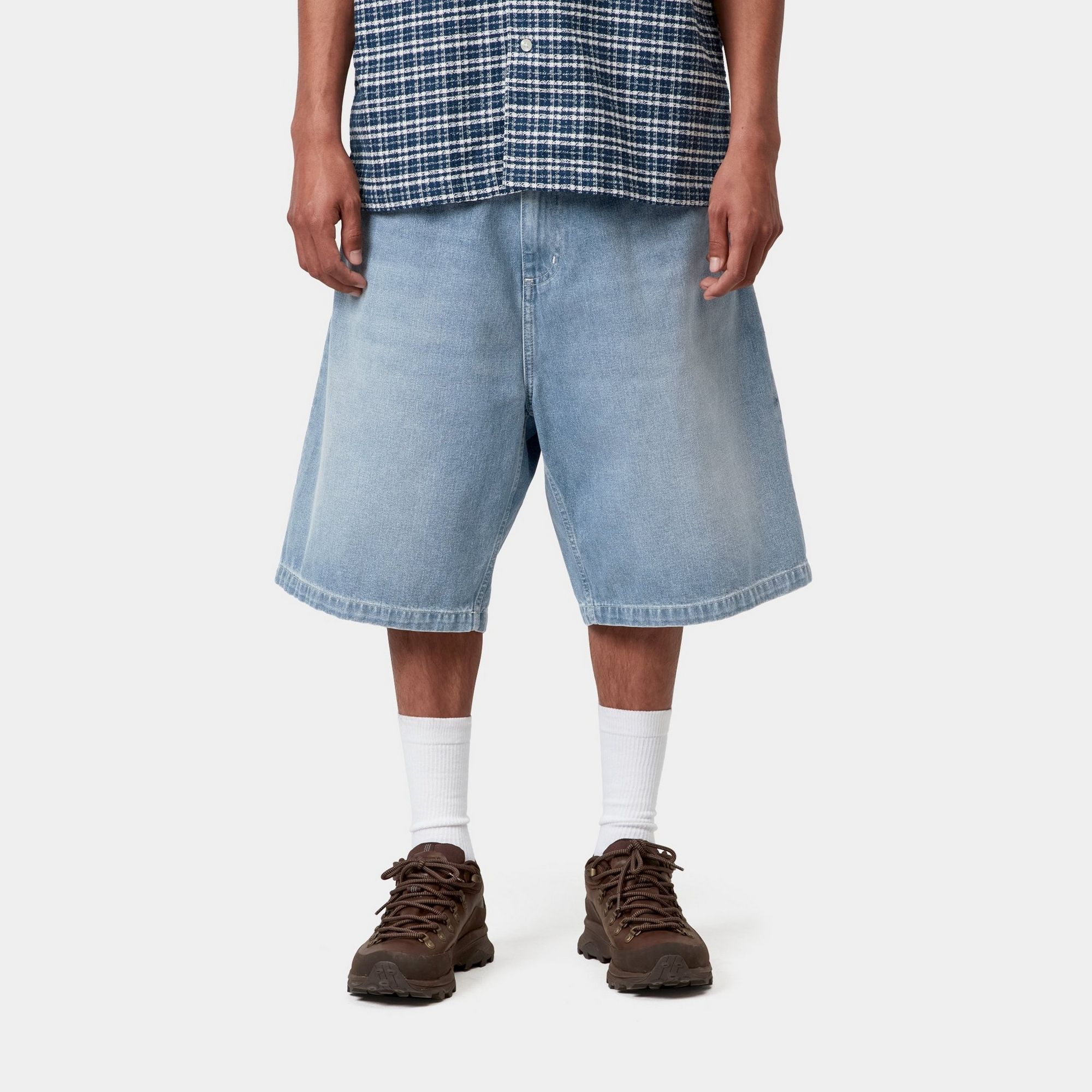 Model wearing a pair of Brandon Shorts in Norco Denim