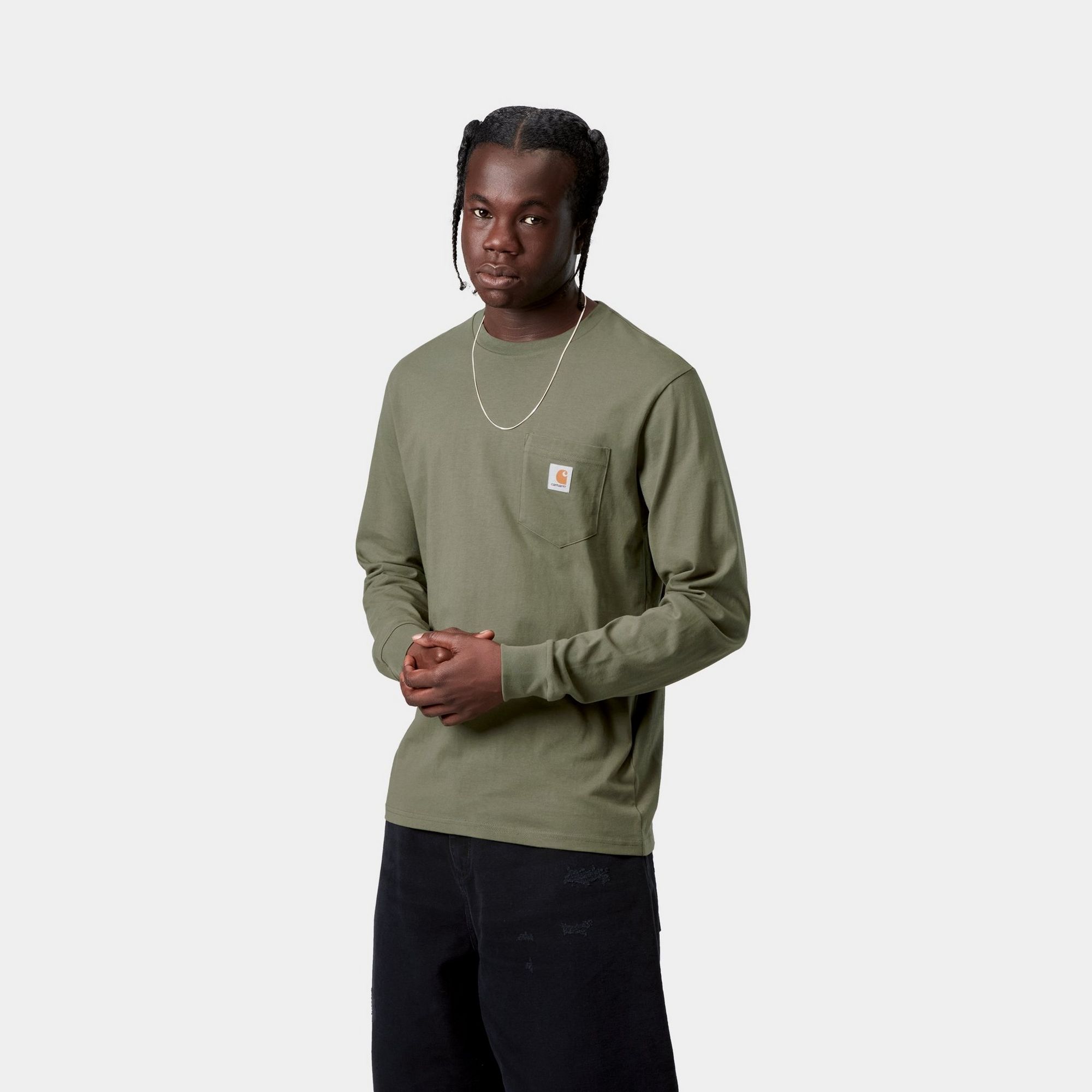 Model wearing a Long Sleeve Pocket T-Shirt in Leaf