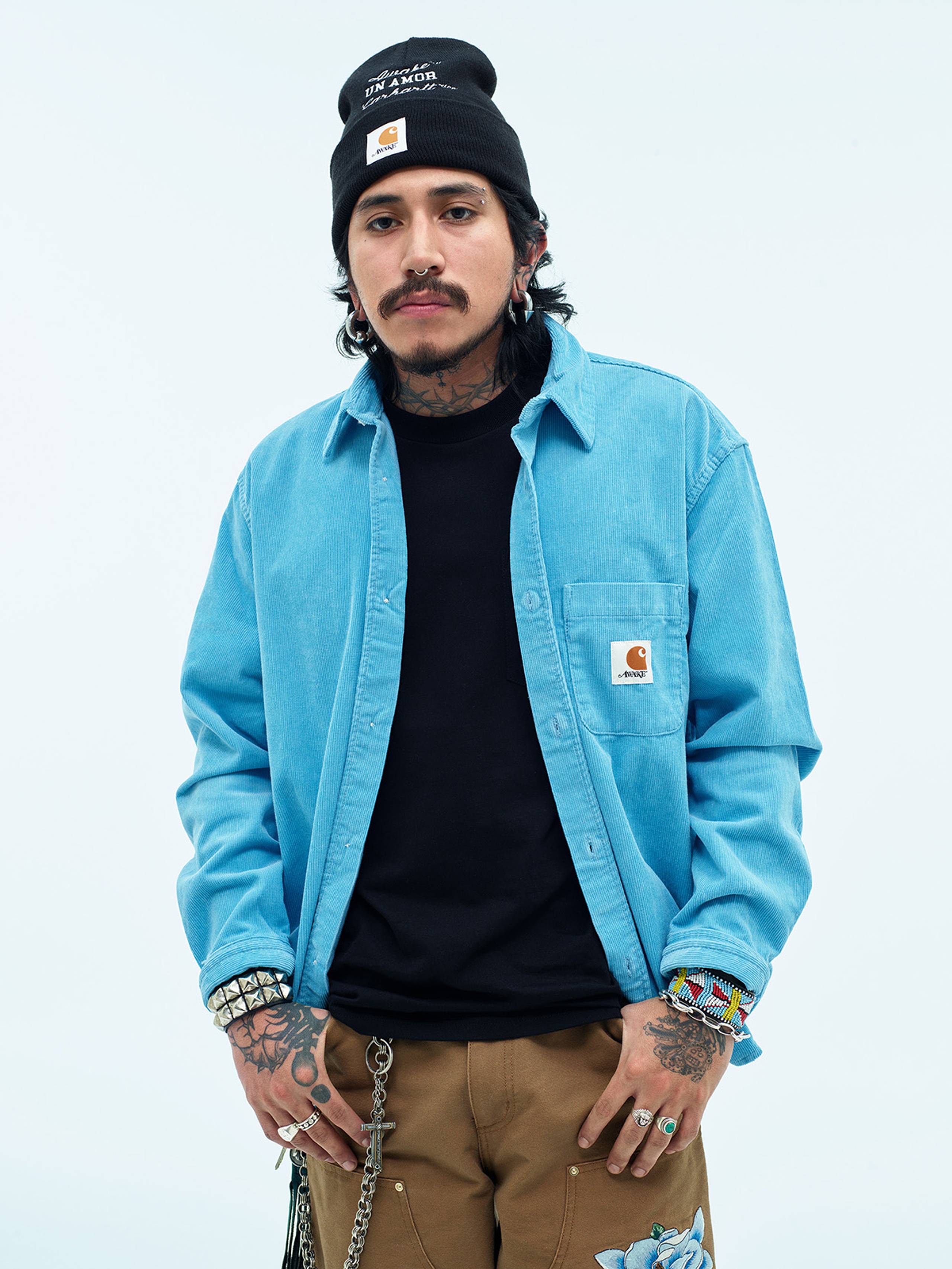 Model wearing Carhartt WIP x Awake NY Button down shirt in blue