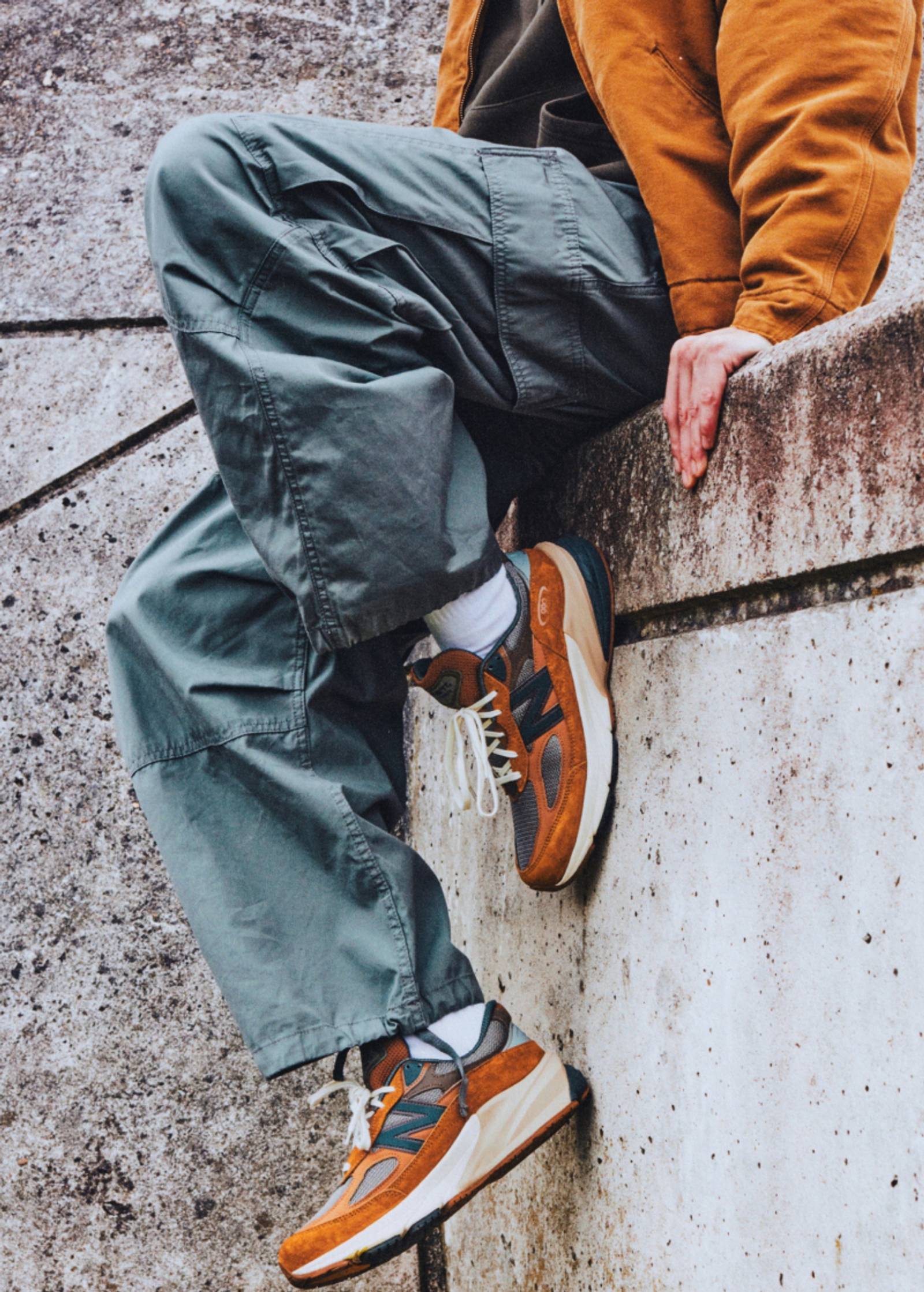 Photo of model wearing Carhartt WIP x New Balance sneakers