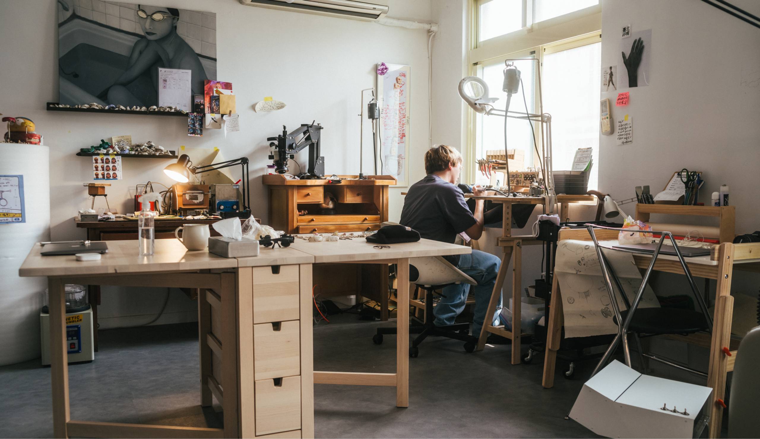 Jewelry Designer Eric Wu working in studio