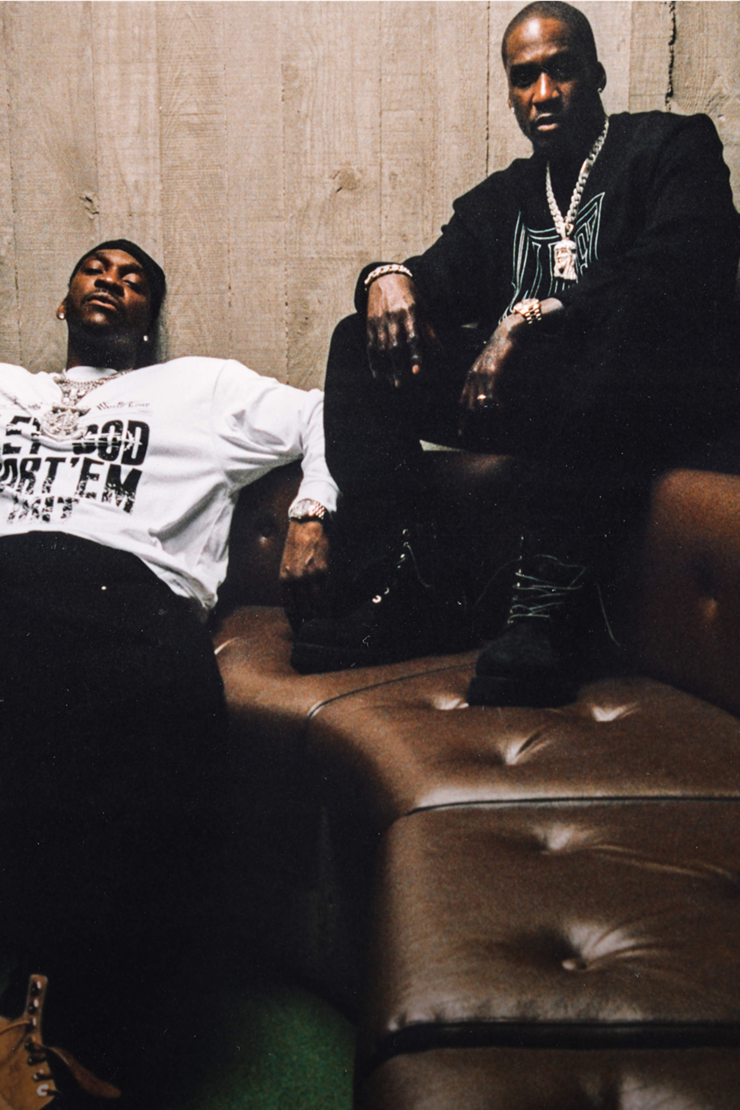 Artist Pusha T and Malice on a couch wearing items from the Carhartt WIP x CLIPSE collab
