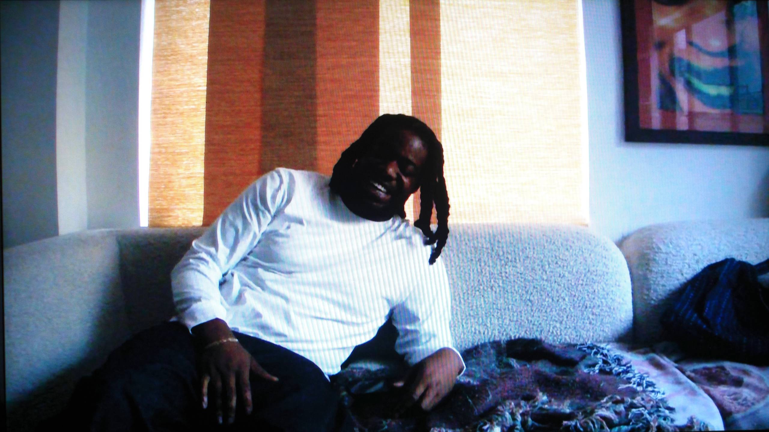 Person in a white shirt on a couch