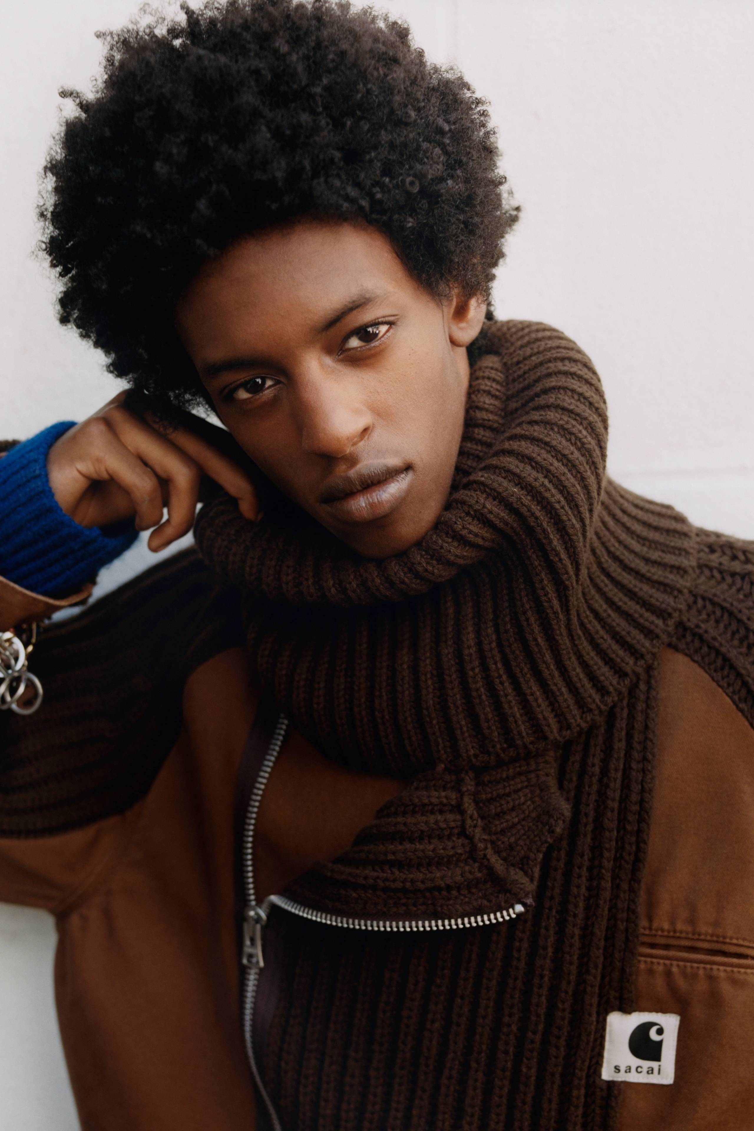 Model wearing a sacai x Carhartt WIP Washed Duck x Wool Knit Blouson