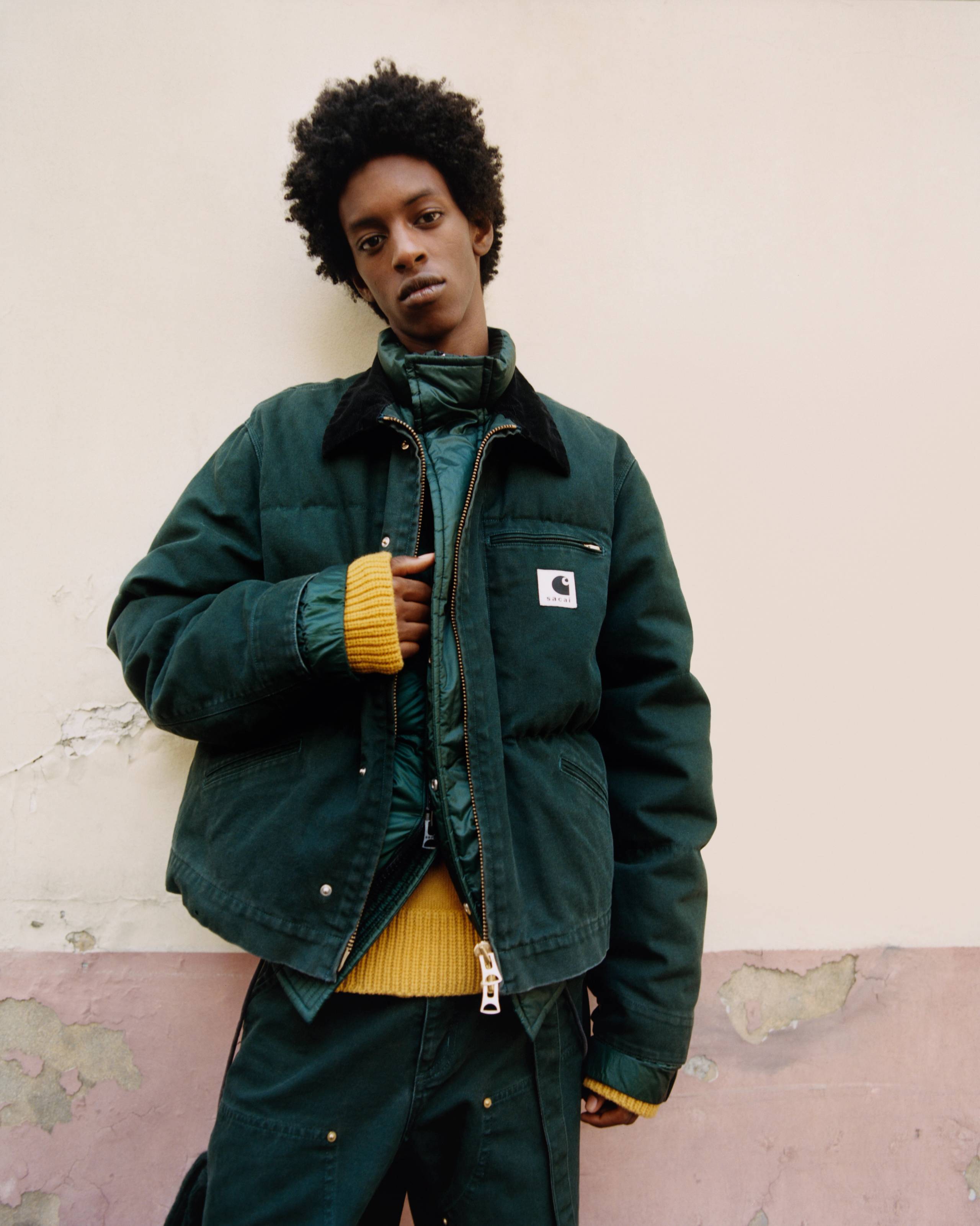 person wearing a sacai x Carhartt WIP jacket and pants